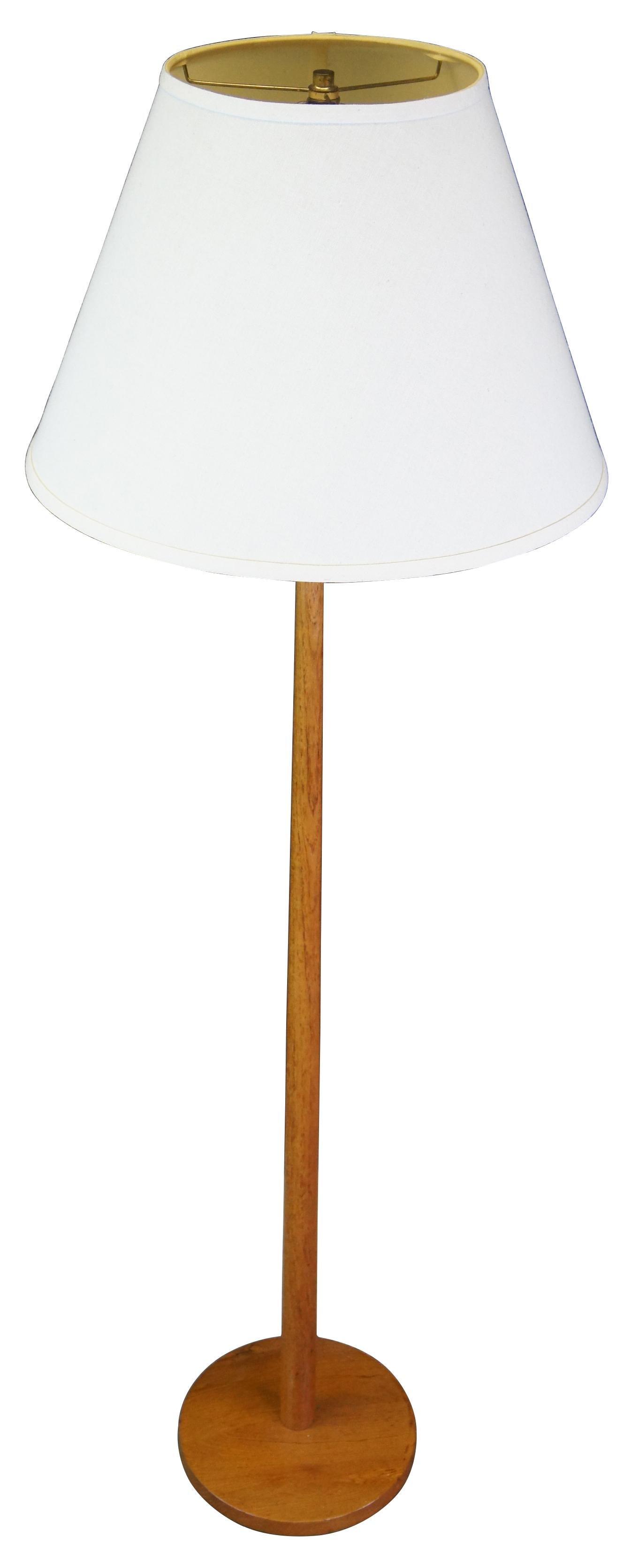 Minimalist Swedish modern floor lamp, circa 1960s. Made in Sweden for George Kovacs. A sleek design with rich wood and white shade. Measures: 56