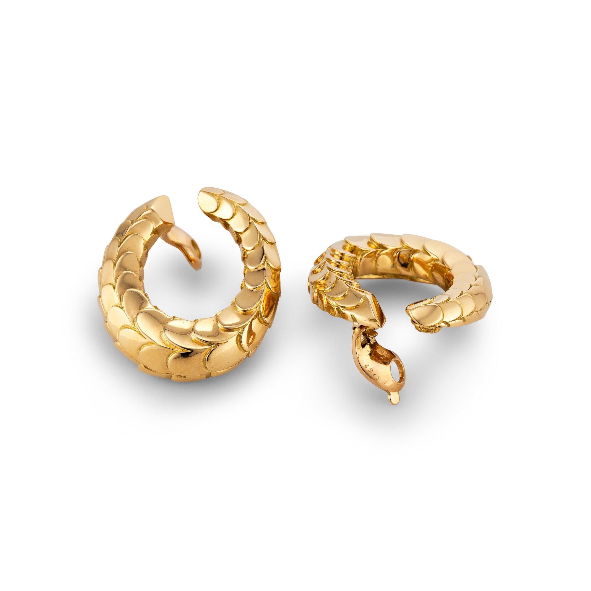 The perfect gold clip hoop earrings have finally been found!  With a chic scale surface pattern, these bespoke earrings were designed in the 1970' by George L'Enfant for Cartier Paris and will easily take you from day to night.  18 karat yellow