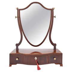 Antique George lIl mahogany dressing mirror on a serpentine box stand, 1790