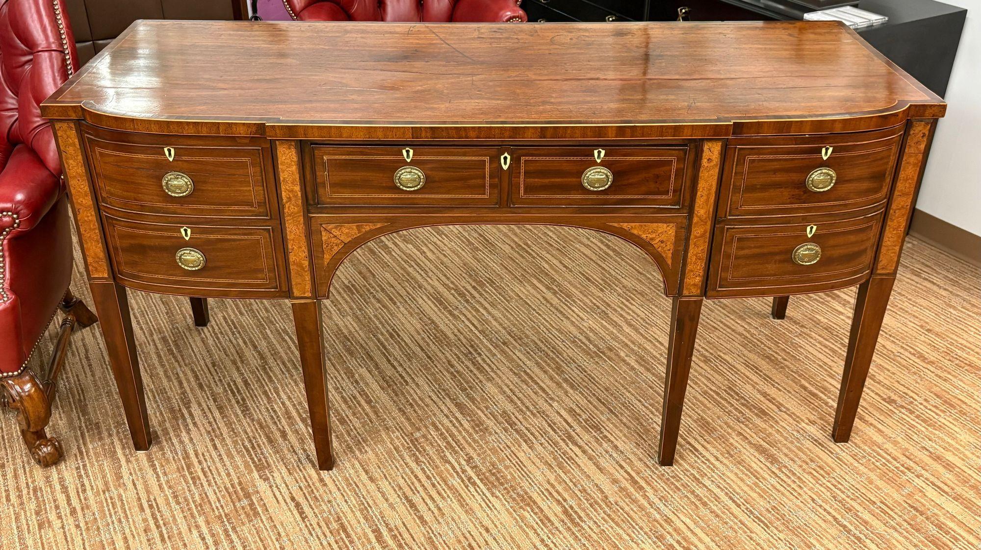 18th / 19th Century George lll Sideboard, Mahogany, Wine Drawer, Inlaid

A very good George III period inlaid mahogany sideboard. Of break fronted form with a central long drawer flanked by a pair of deep drawers (one fitted as a cellarette).