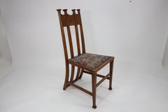 George Montague Ellwood. Realizzato da J.S. Henry. Un raro set di dieci sedie da pranzo in Oak.