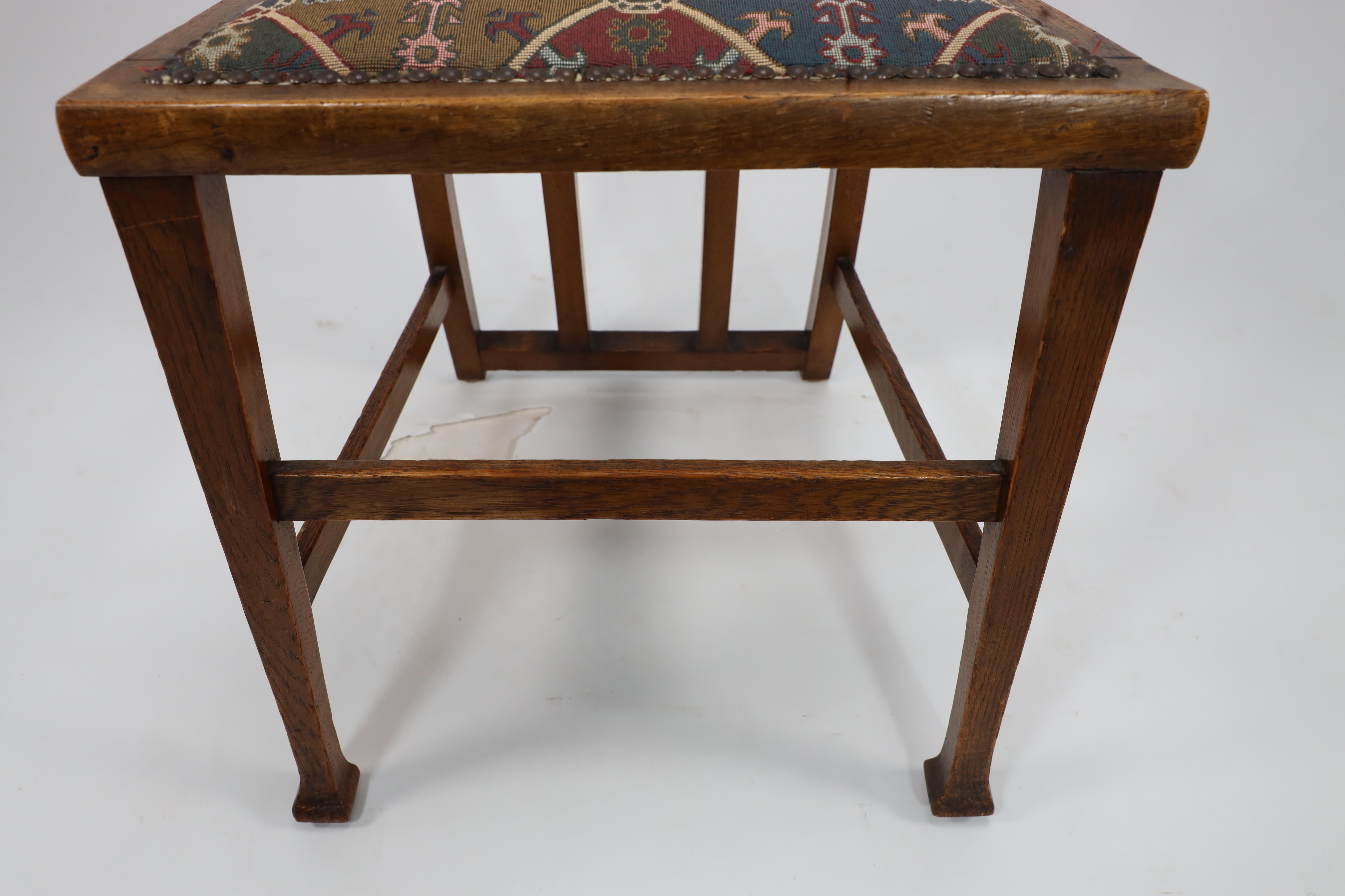 George Montague Ellwood. Made by J S Henry. A rare set of ten oak dining chairs. For Sale 3