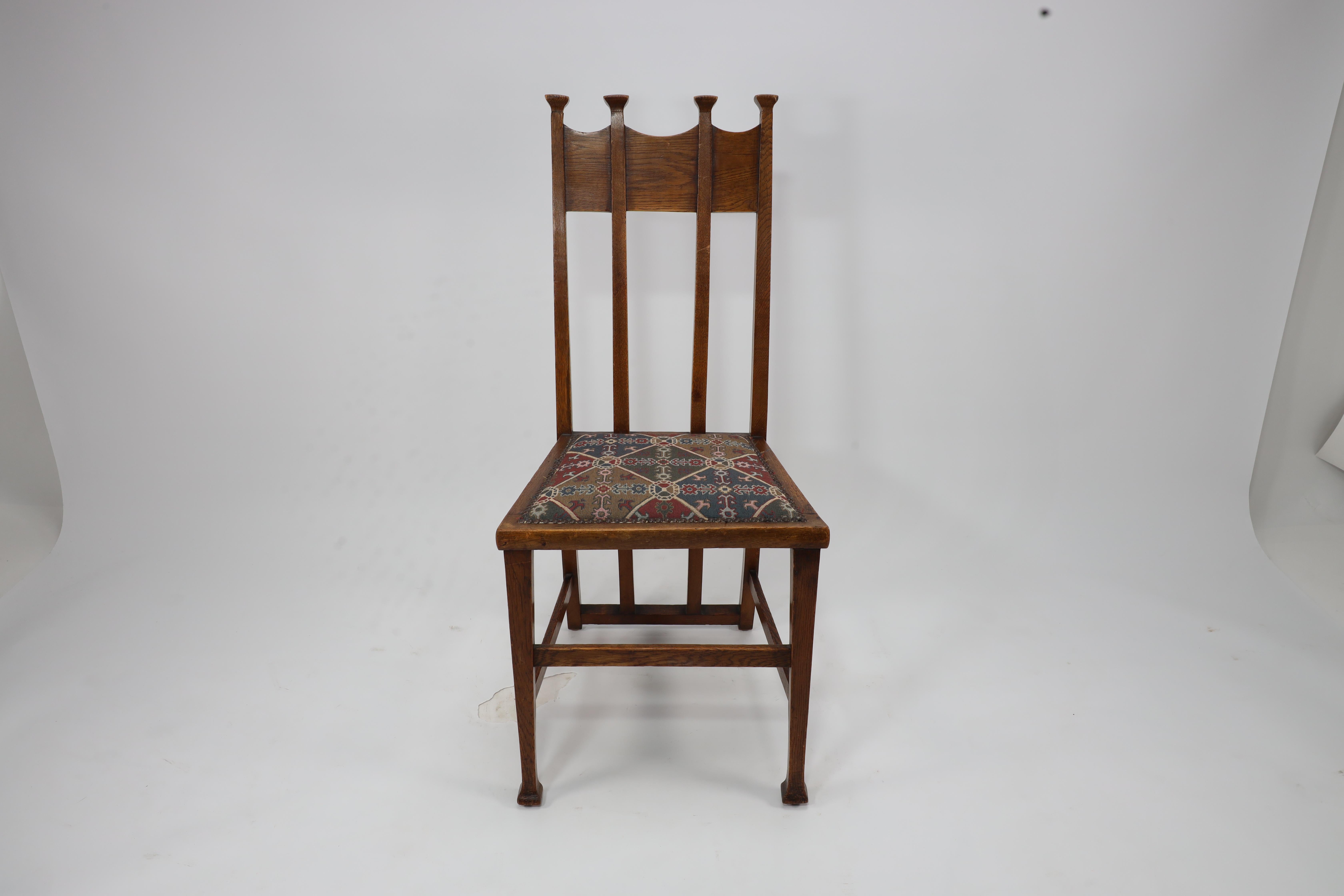 Arts and Crafts George Montague Ellwood. Made by J S Henry. A rare set of ten oak dining chairs. For Sale
