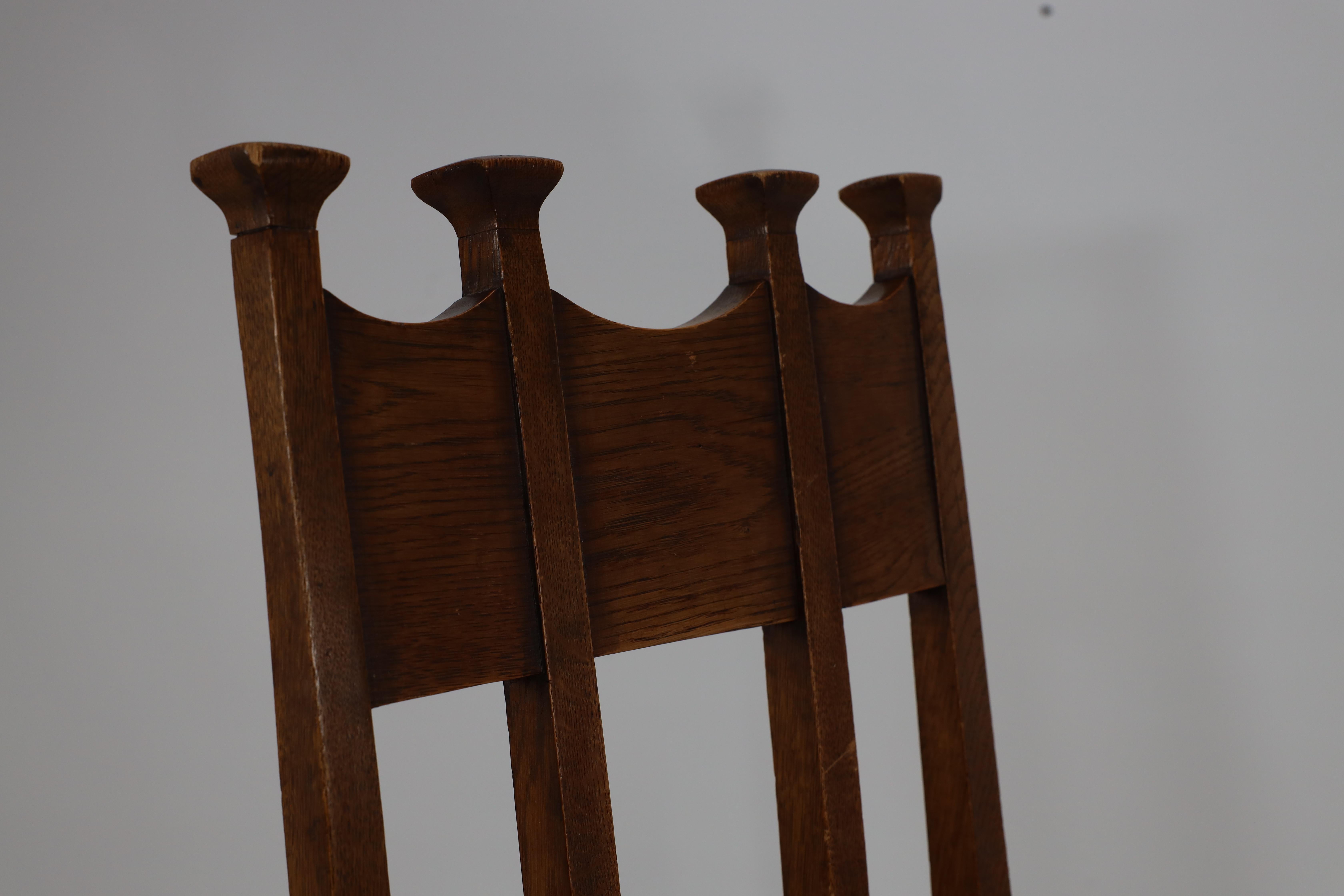Oak George Montague Ellwood. Made by J S Henry. A rare set of ten oak dining chairs. For Sale