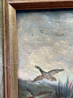 English 19th-century, man out Duck Shooting in a landscape with his spaniel dogs