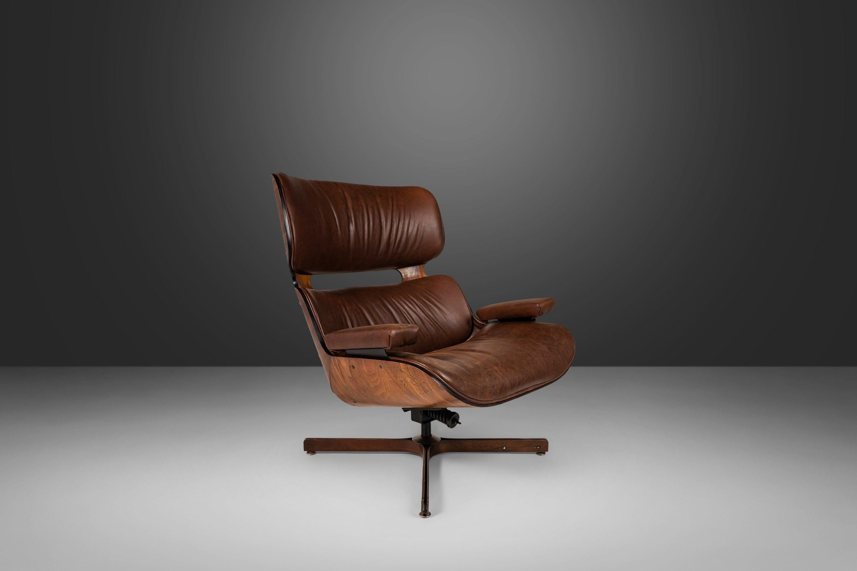 The perfect amalgamation of comfort and style, this iconic chair is a superb archetype for American mid-century seating design. This vintage design has recently received a modern upgrade from the original leatherette to genuine leather hide