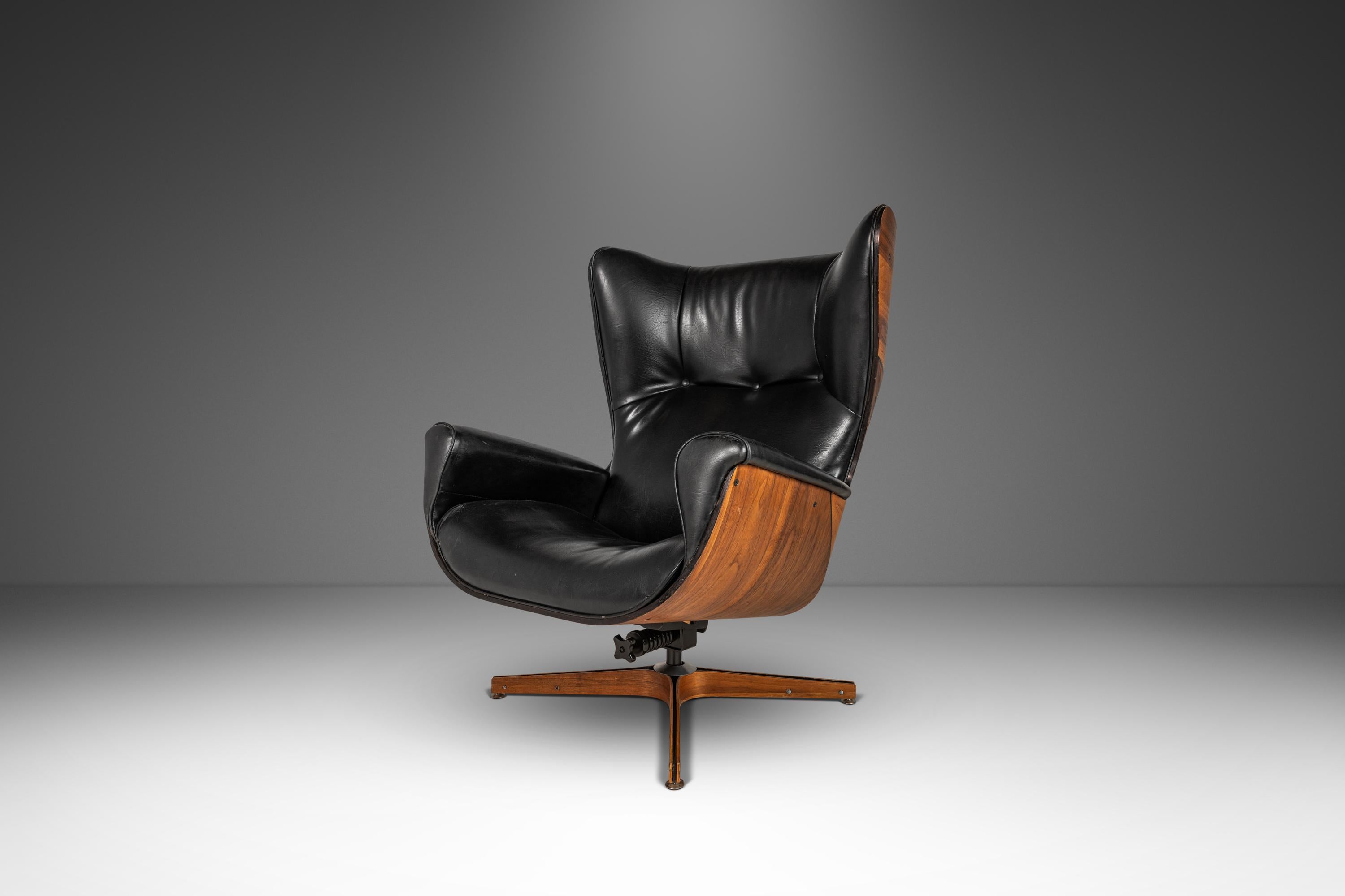 Attention collectors! Equal parts comfort and style this iconic wingback Mr. Chair, designed by the acclaimed George Mulhauser, is the epitome of functional art. In 100% original, vintage condition this ground-breaking model is practically as good