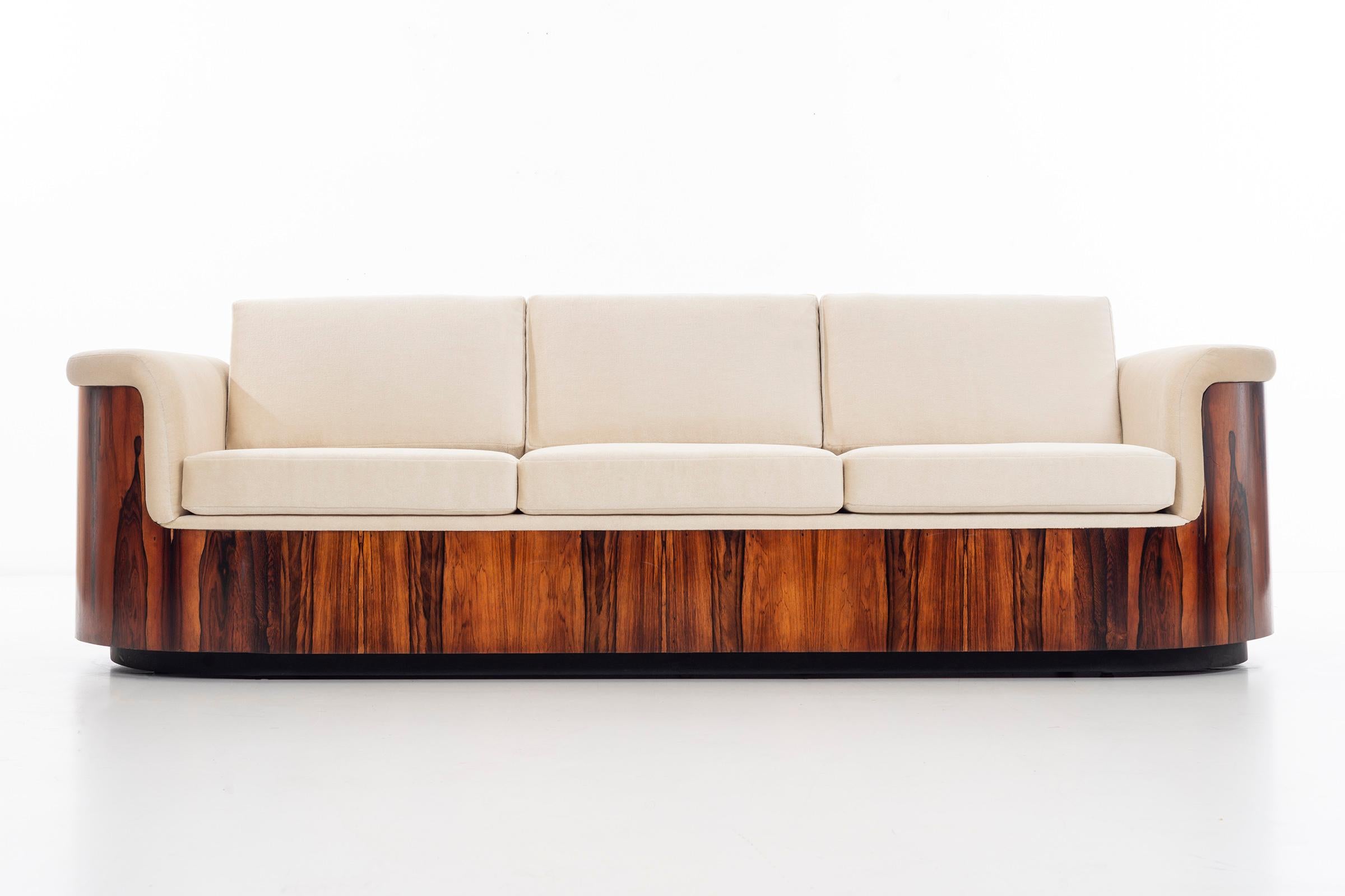 Mulhauser for Plycraft tub sofa, continuous rosewood figured veneer structure with Great Plains by Holly Hunt Mohair seats and back.
Measures: Seat height 18.5.