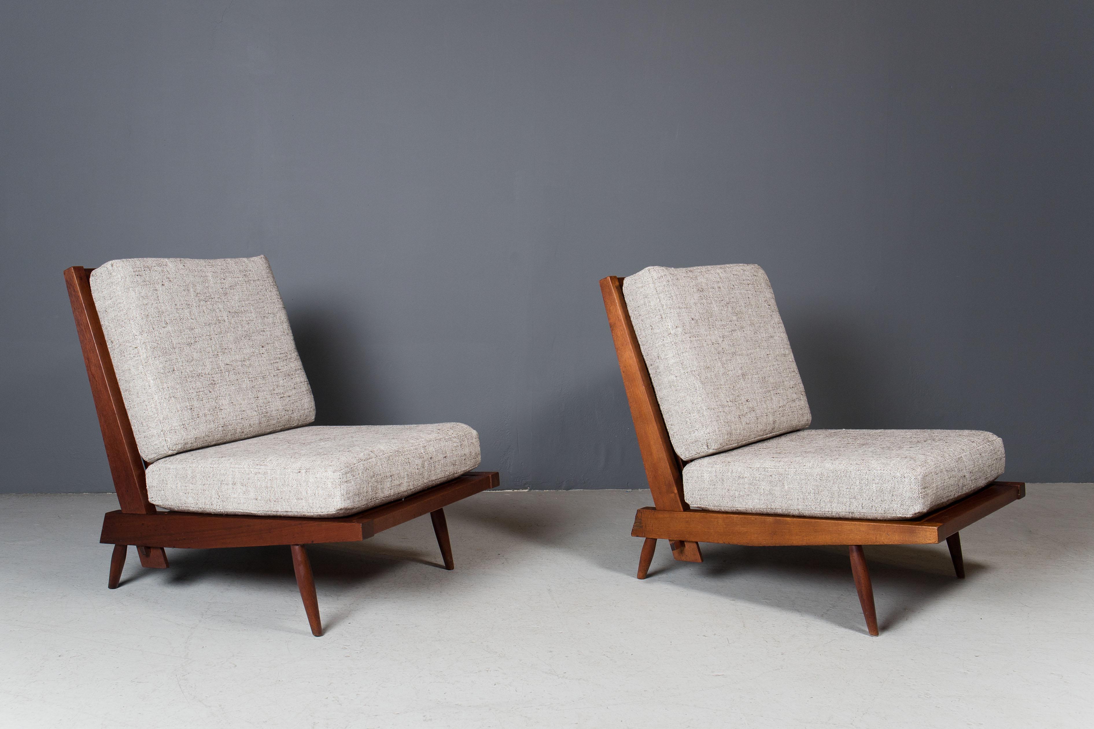 Pair of black walnut armless chairs by George Nakashima, ca 1960s.
Walnut frames have been cleaned and conditioned with oil, cushions are newly made.
Beautiful patina throughout.

  
