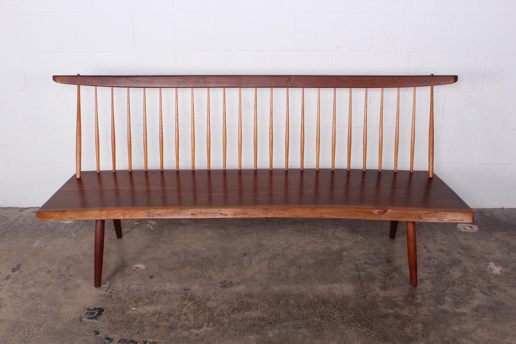 A walnut bench by George Nakashima signed and dated 1976. Sold with full documentation.