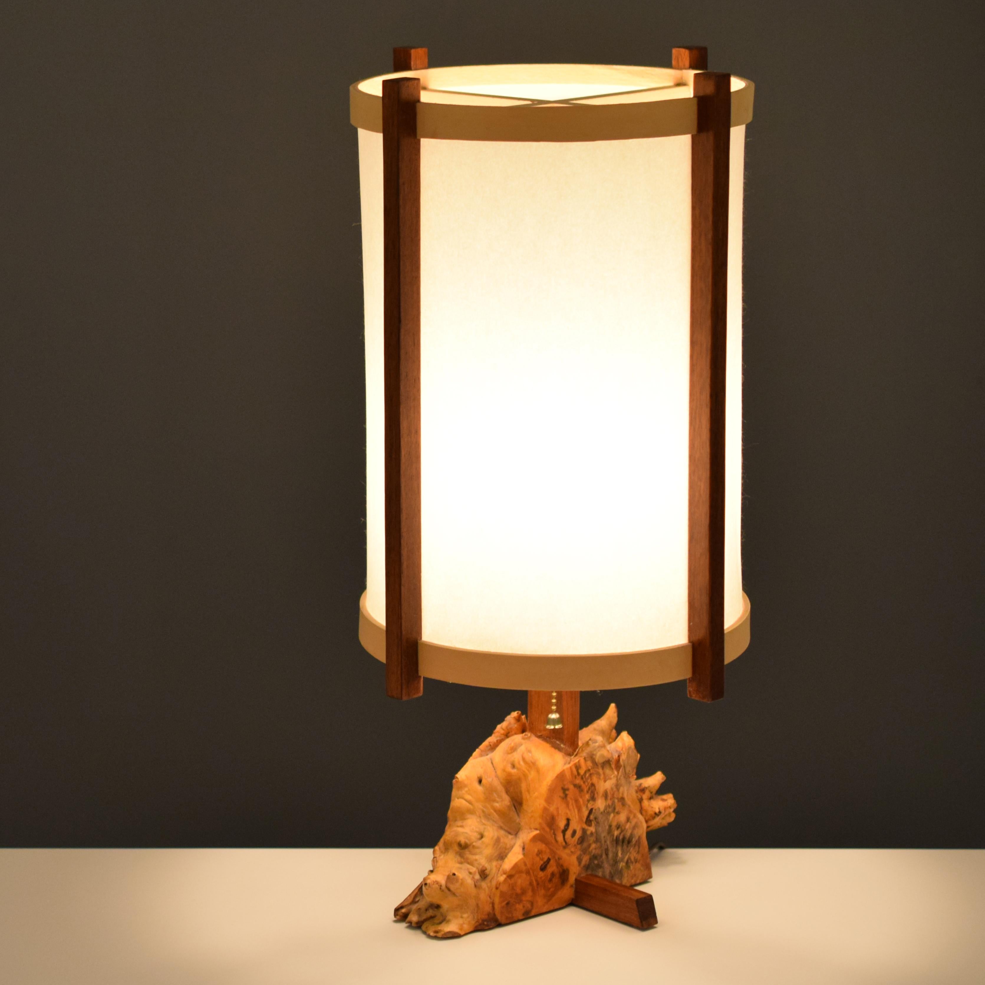 This lamp has an unusually complex burl base that exemplifies the mastery of Nakashima's amazing selection of woods for his pieces.