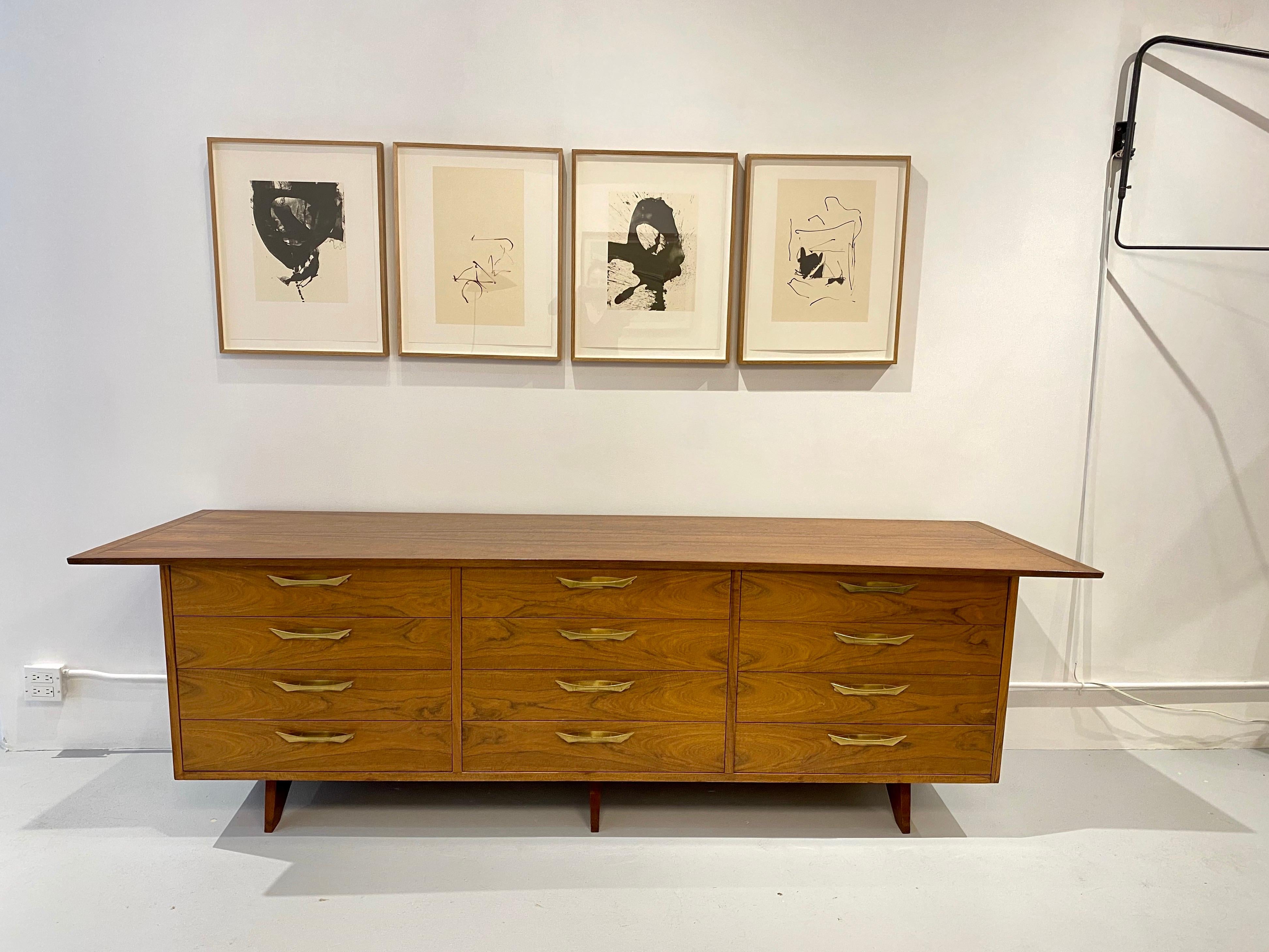 Chest of 12 drawers by George Nakashima, model OH - 212 L with bookmatched walnut drawer fronts and brass handles, designed for Widdicomb, circa 1950.
Cabinet retains its fabric label and is branded with manufacturer’s mark to drawer George