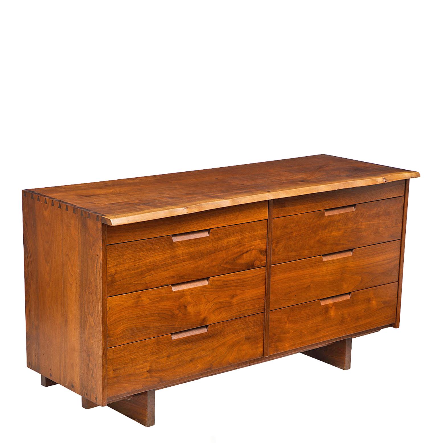 Solid walnut chest of drawer with free edge front and cabinets makers details, made in George Nakashima Studio circa 1970s.