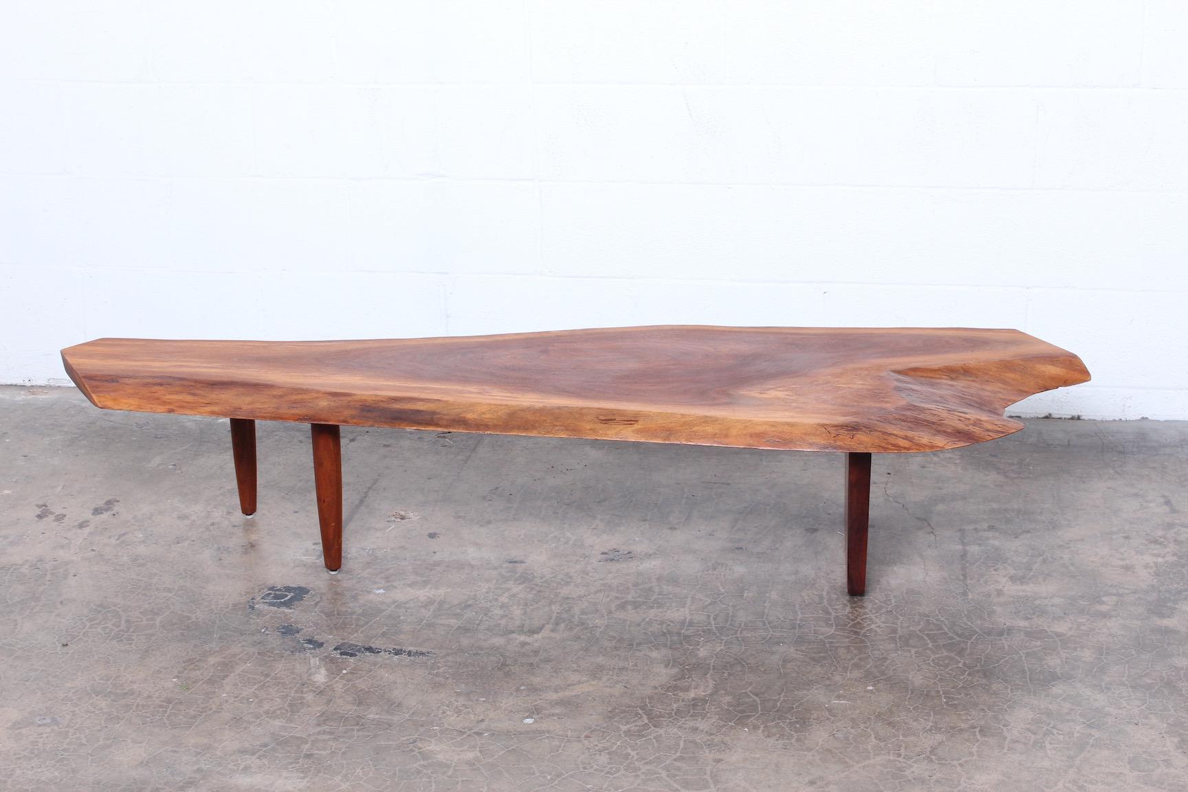 Walnut coffee table or bench by George Nakashima, 1980.