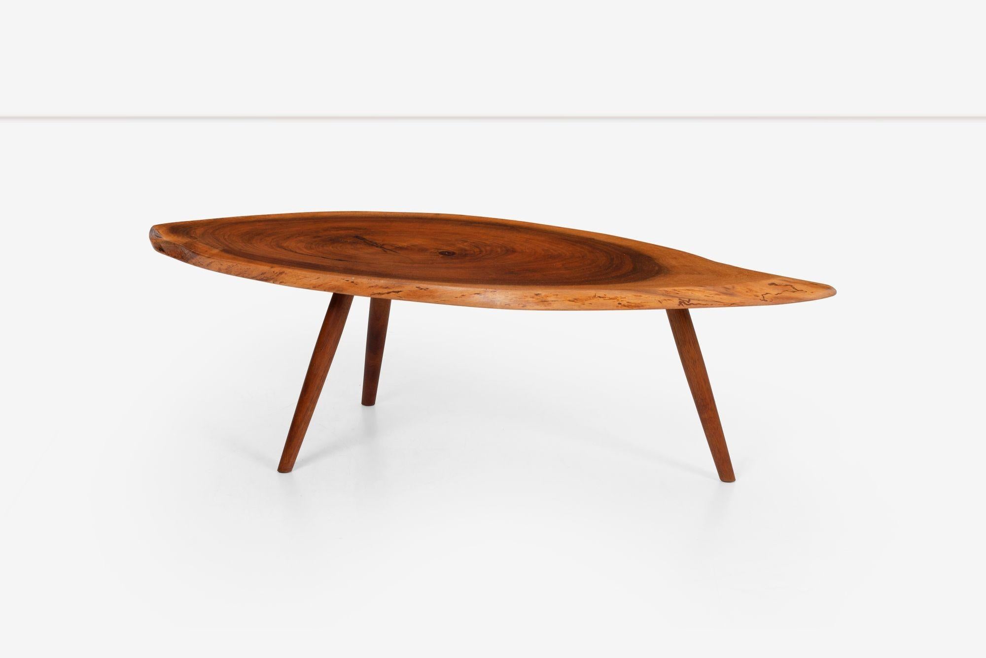 George Nakashima coffee table in black walnut, solid live-edge top with exotic figured rinnge with solid turned legs.