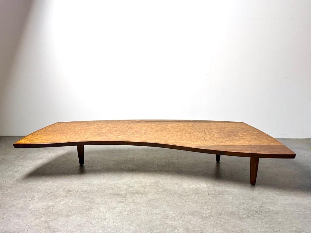 George Nakashima coffee table for Widdicomb 1960
Model 200-84w of the Origins Collection

Impressive example in Carpathian Elm burl and Laurel with Sundra finish 
Effortlessly supported by three sculpted walnut tapered legs

Original label intact