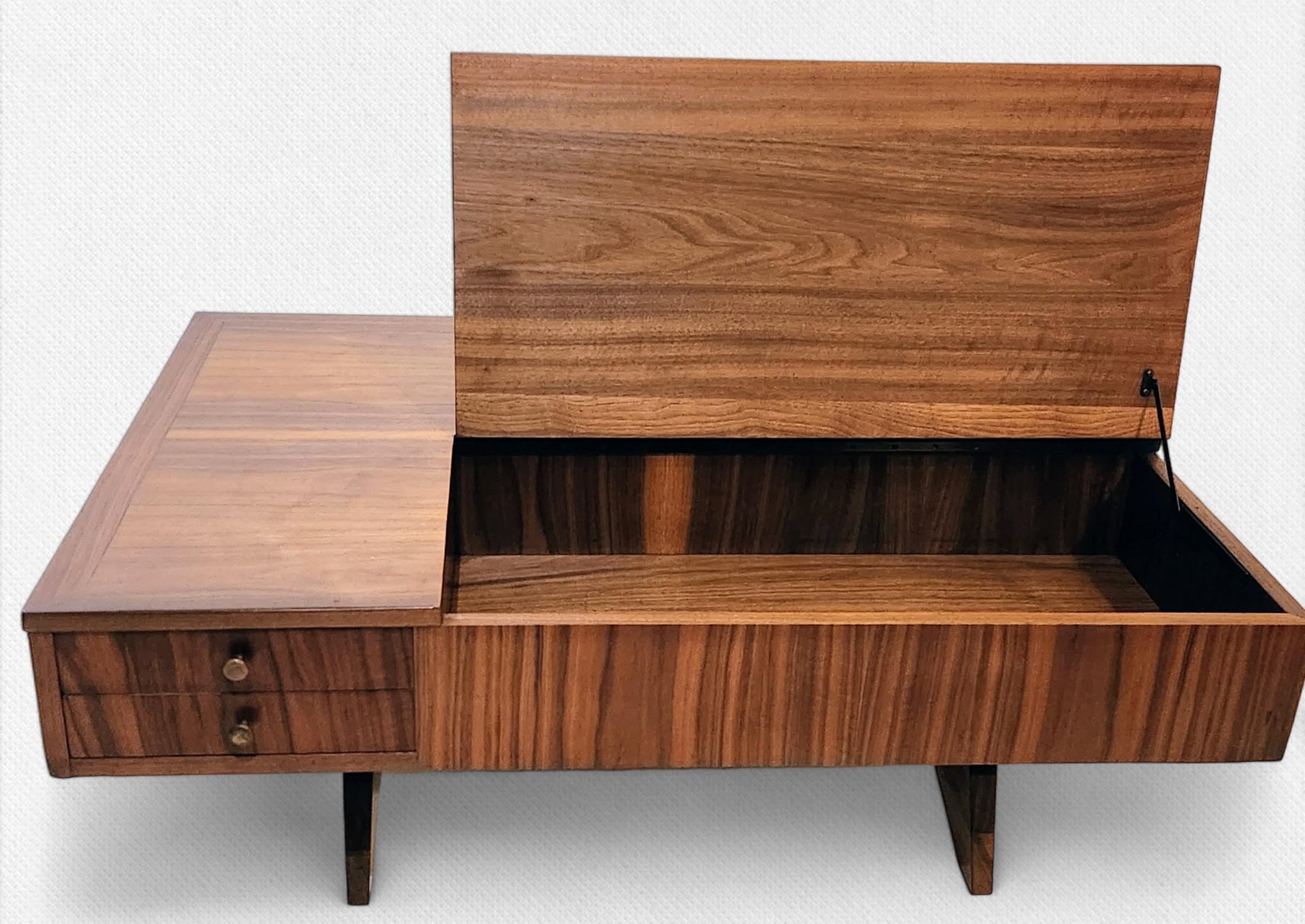 George Nakashima lift-top coffee table model 272 manufactured by Widdicomb in 1959 from his origins line.
The underside of the drawer is stenciled Sundra model 272 dated 3/59.
Widdicomb produced their Nakashima designed line of furniture 