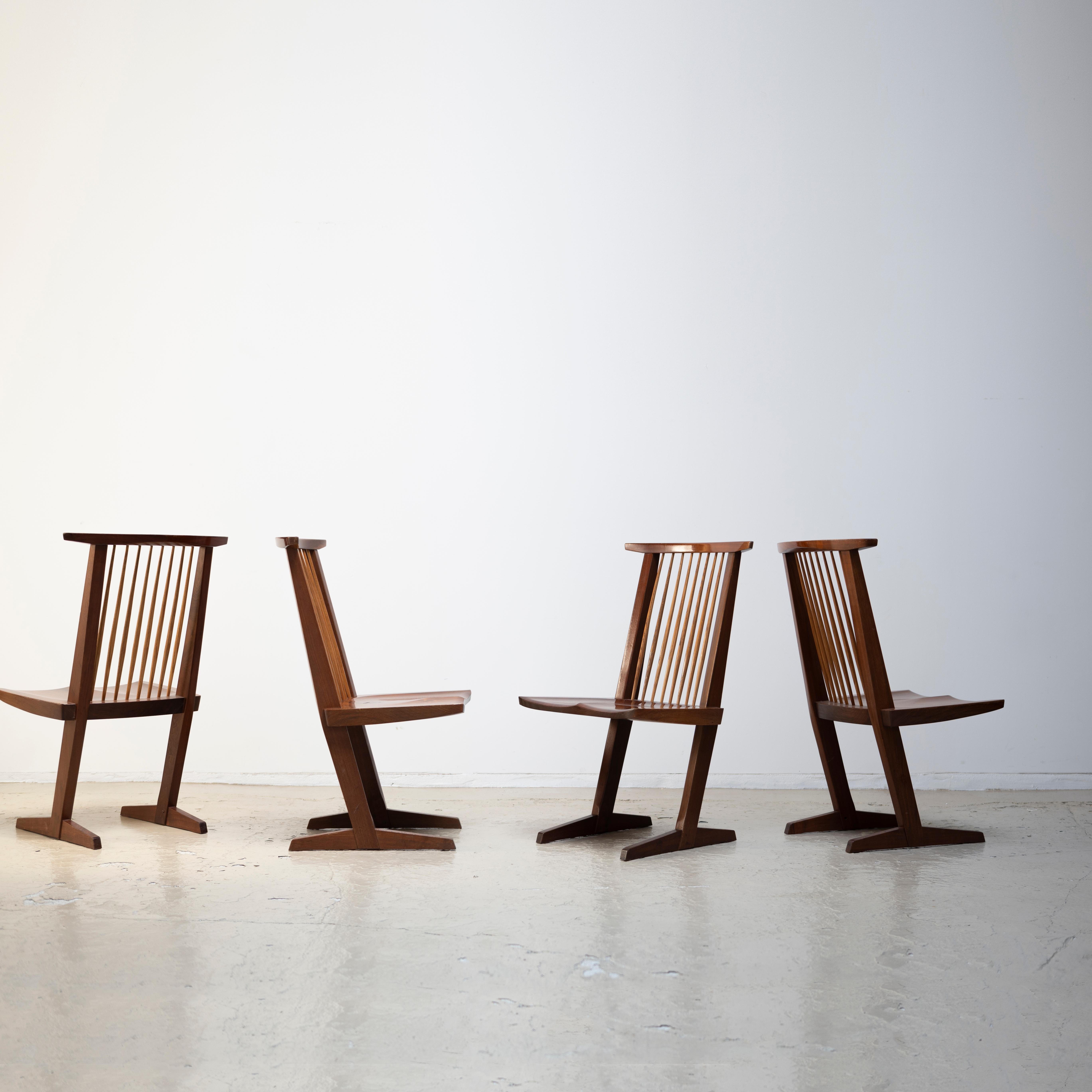A set of four Conoid chairs designed by George Nakashima.
1970s.
Manufactured by Sakura Seisakusho in Kagawa, Japan.
This model was invented in 1959 and started to be sold in Japan in 1964.

Sakura Seisakusho is only one manufacturer of George