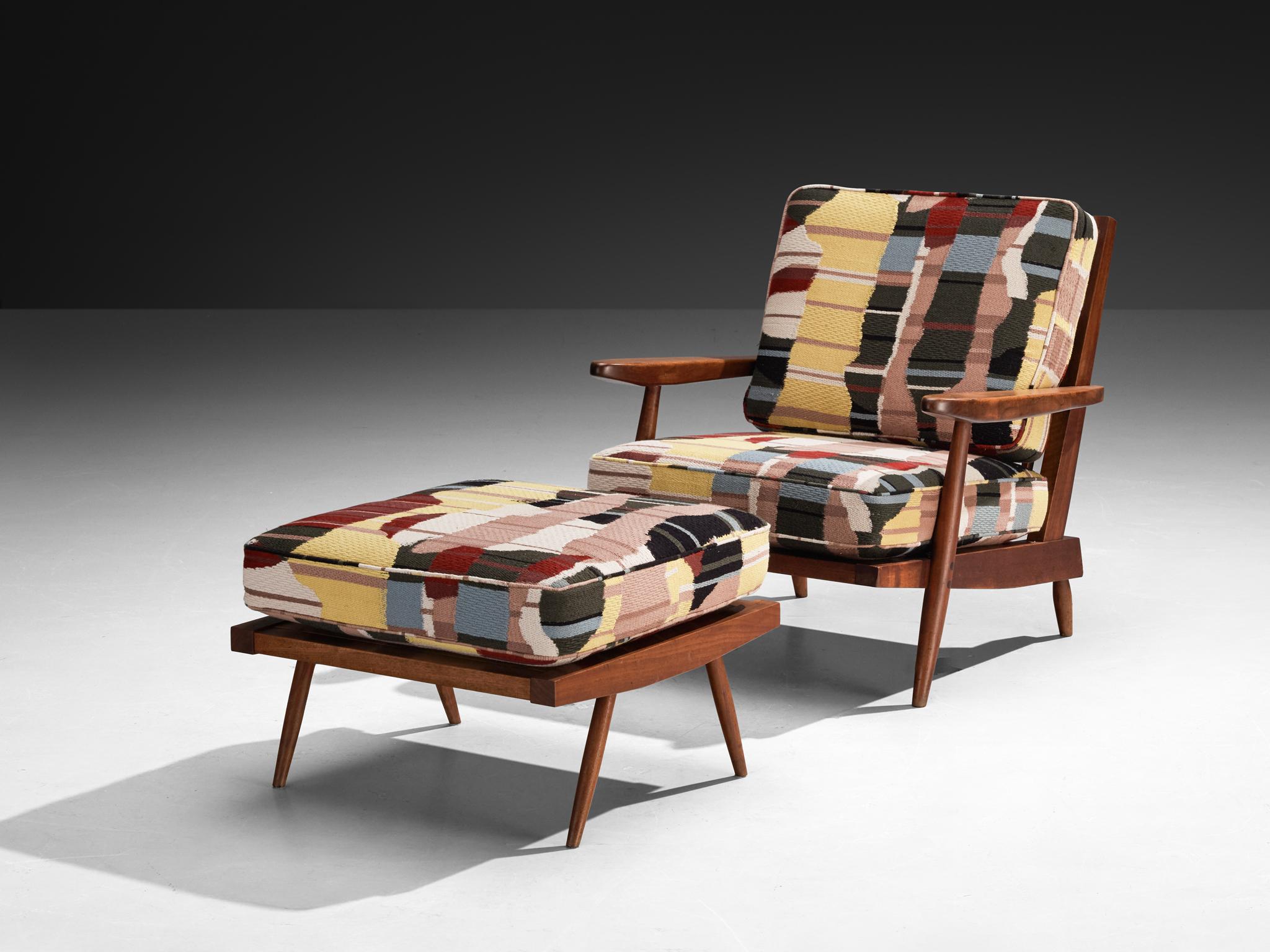 George Nakashima for Nakashima Studio, 'Cushion' lounge chair and ottoman, American black walnut, fabric Pierre Frey “Chupa” Vegetale, United States, 1960s  

This quintessential Cushion spindle back armchair is designed by George Nakashima.