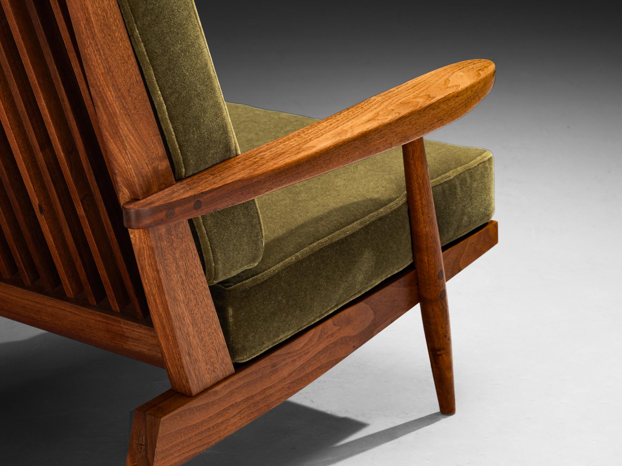 George Nakashima for Nakashima Studio, ‘Cushion’ spindleback lounge chair, American black walnut, reupholstered in “Bold Army” by Pierre Frey, United States, 1959

This quintessential Cushion spindle back armchair is designed by George Nakashima.