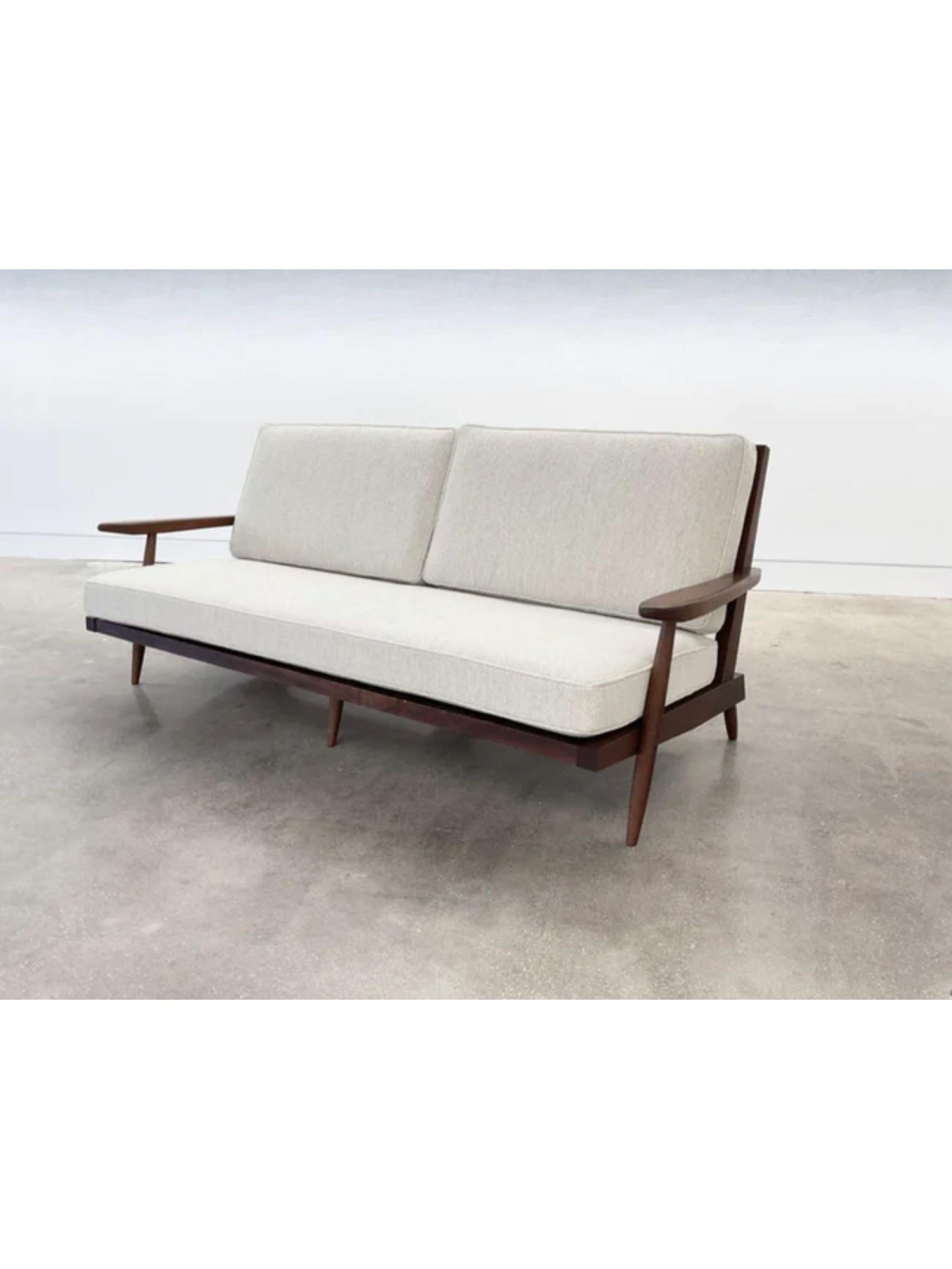 American George Nakashima “Cushion” three seat walnut sofa with arms, USA, 1961