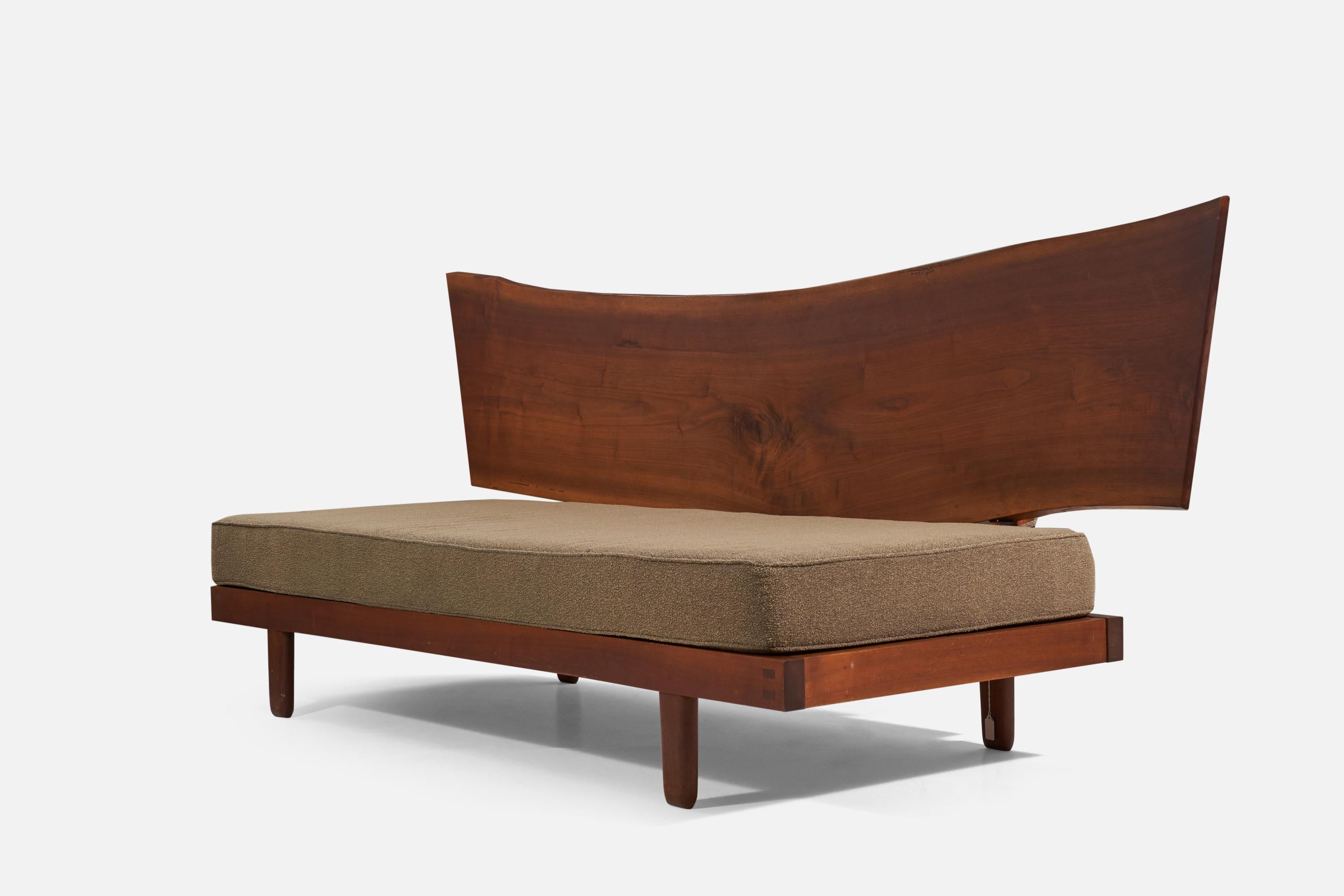 A walnut and fabric daybed designed and produced by George Nakashima, United States, 1969.

Acquired directly from the artist
Property from a Distinguished Private Pennsylvania Collection

This lot is sold with a digital copy of the original