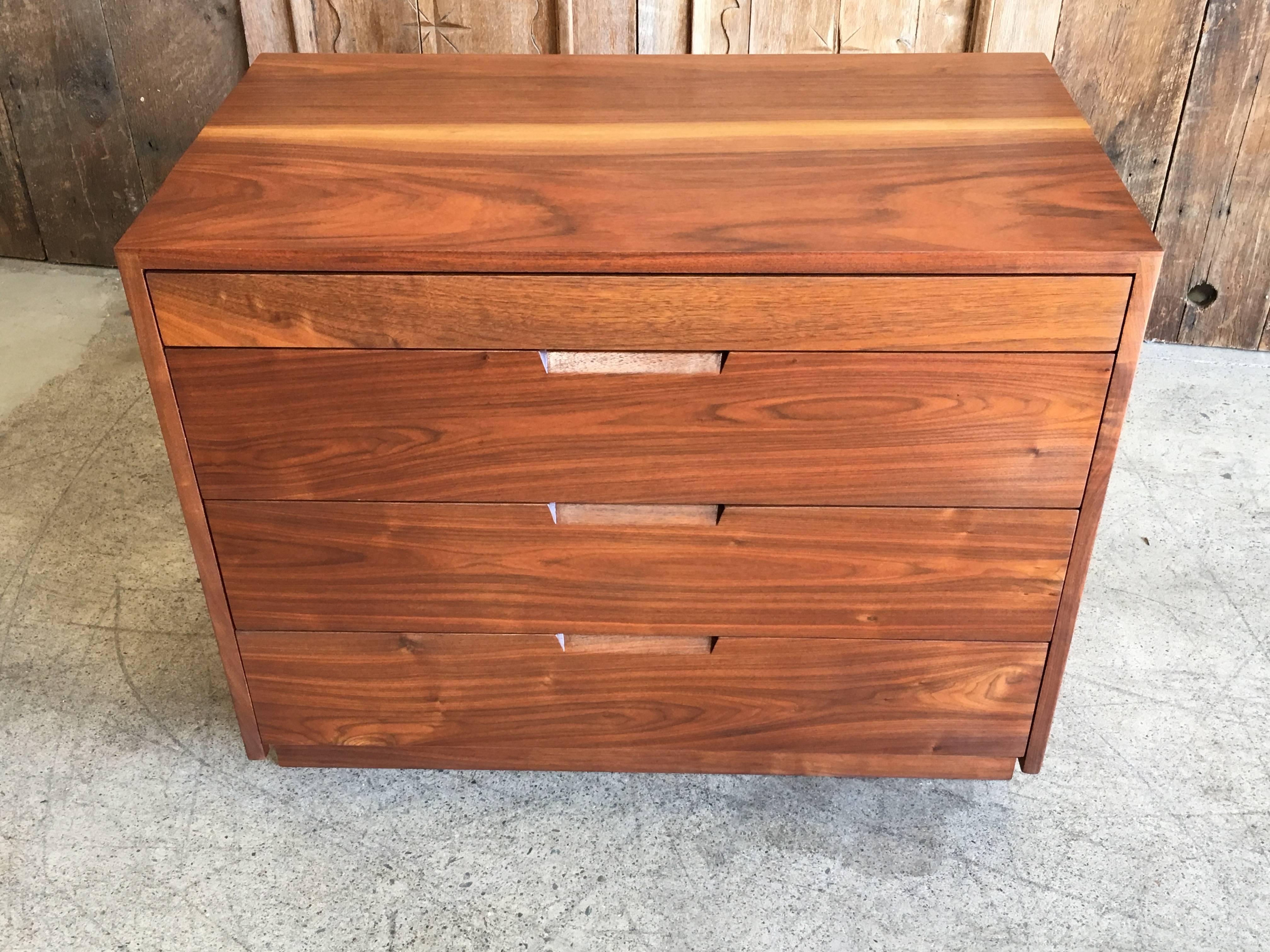 Solid walnut construction chest with exposed dowel joinery.