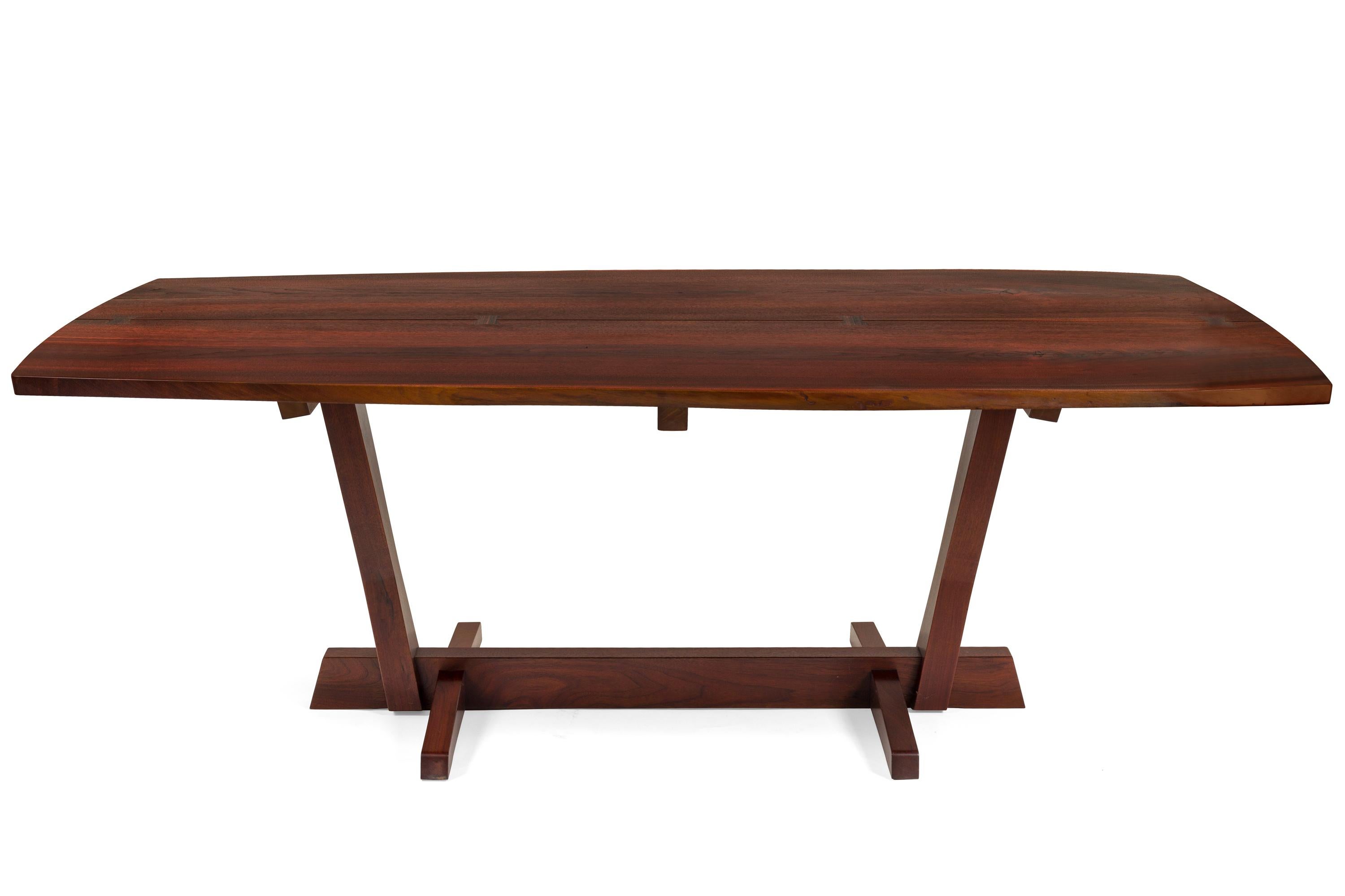 Inspired by the completion of the Conoid Studio in 1959 this dining table is one of the most desirable models that Nakashima produced. A pleasing somewhat irregular shape that defines Nakashima's desire to take advantage of the beauty of the
