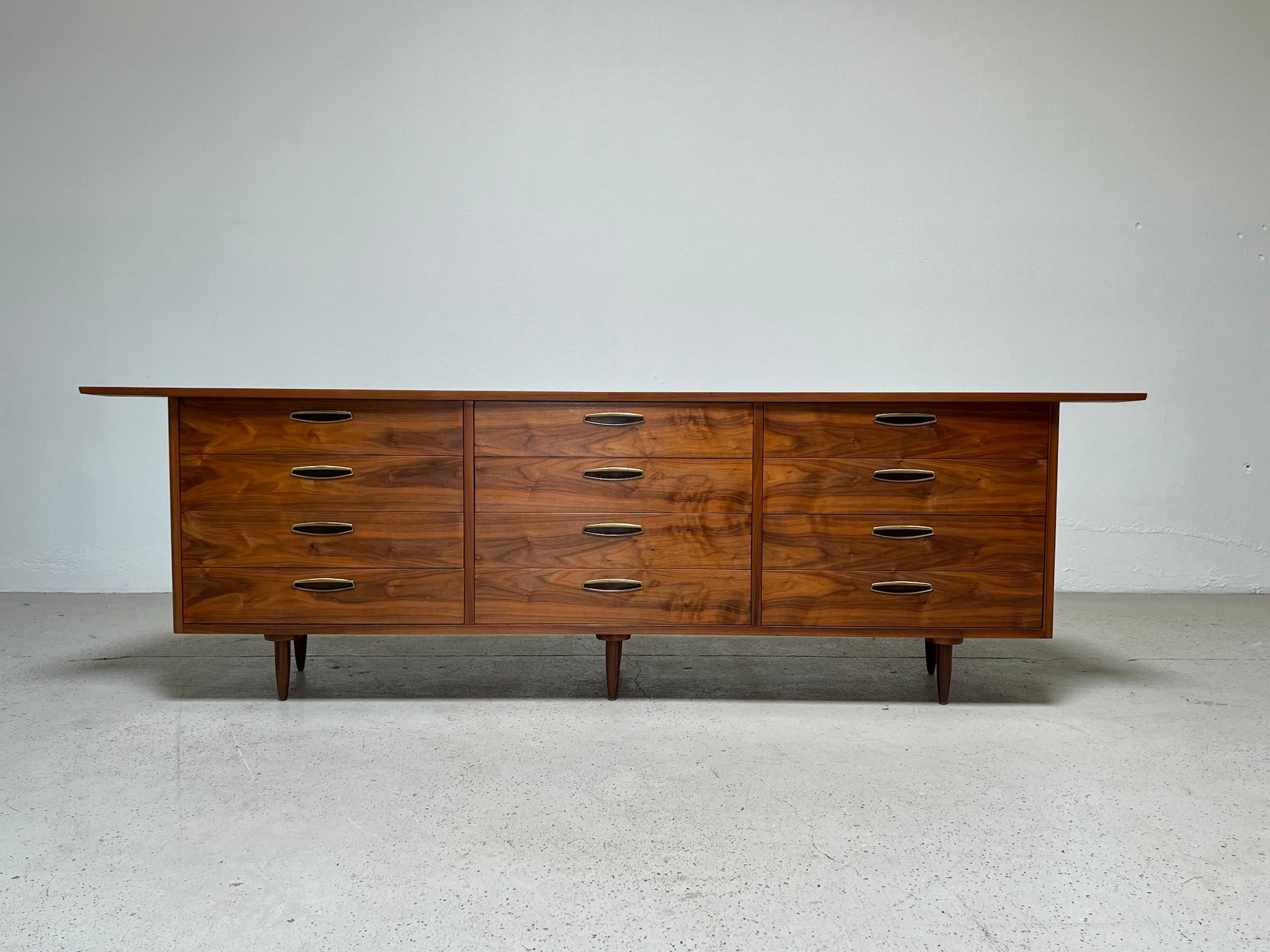 A large George Nakashima for Widdicomb dresser with beautifully grained East Indian Laurel and brass pulls.