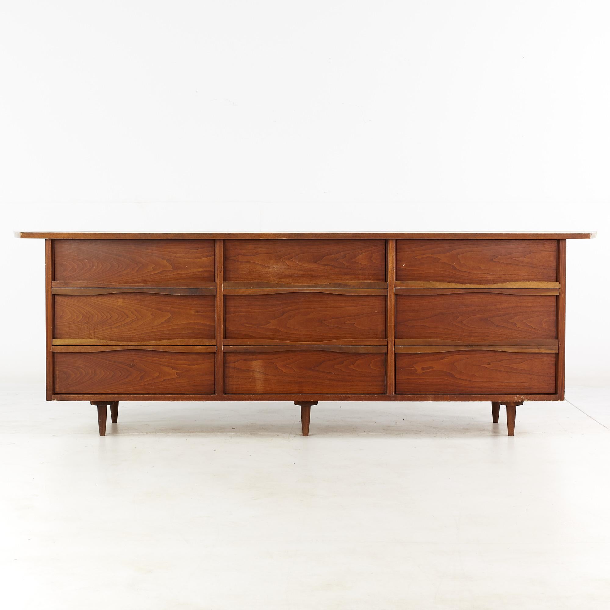 George Nakashima for Widdicomb mid century walnut 9 drawer lowboy dresser

This lowboy dresser measures: 98 wide x 22.5 deep x 32 inches high

All pieces of furniture can be had in what we call restored vintage condition. That means the piece is