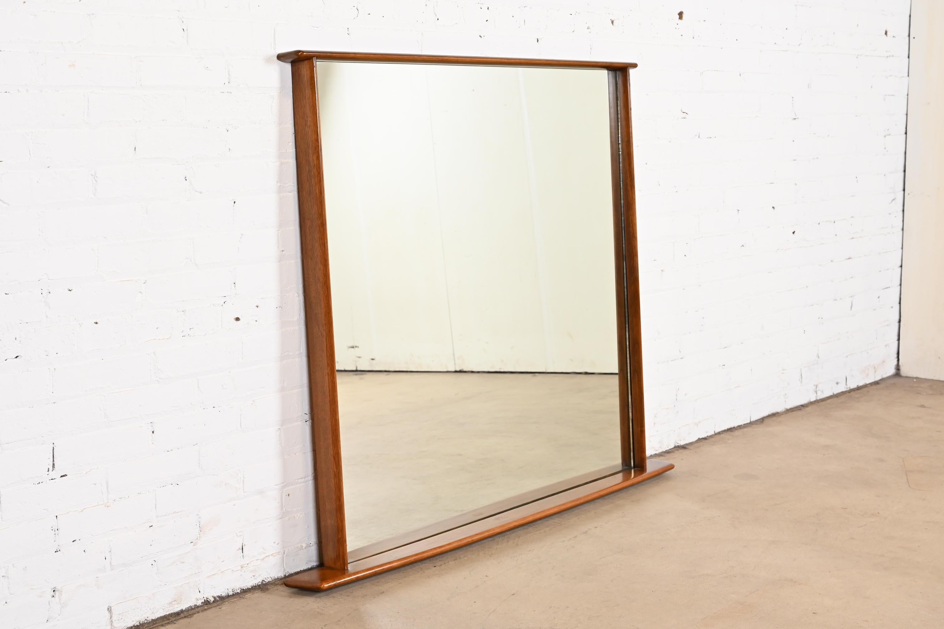 A very rare and exceptional mid-century Organic Modern sculpted walnut framed monumental wall mirror

By George Nakashima for Widdicomb Furniture, 