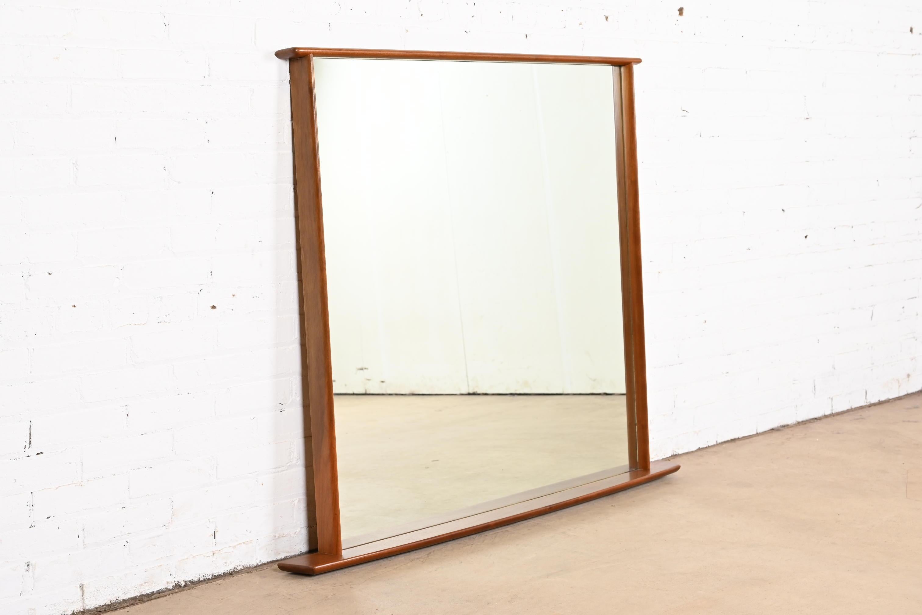 A very rare and exceptional mid-century Organic Modern sculpted walnut framed monumental wall mirror

By George Nakashima for Widdicomb Furniture, 