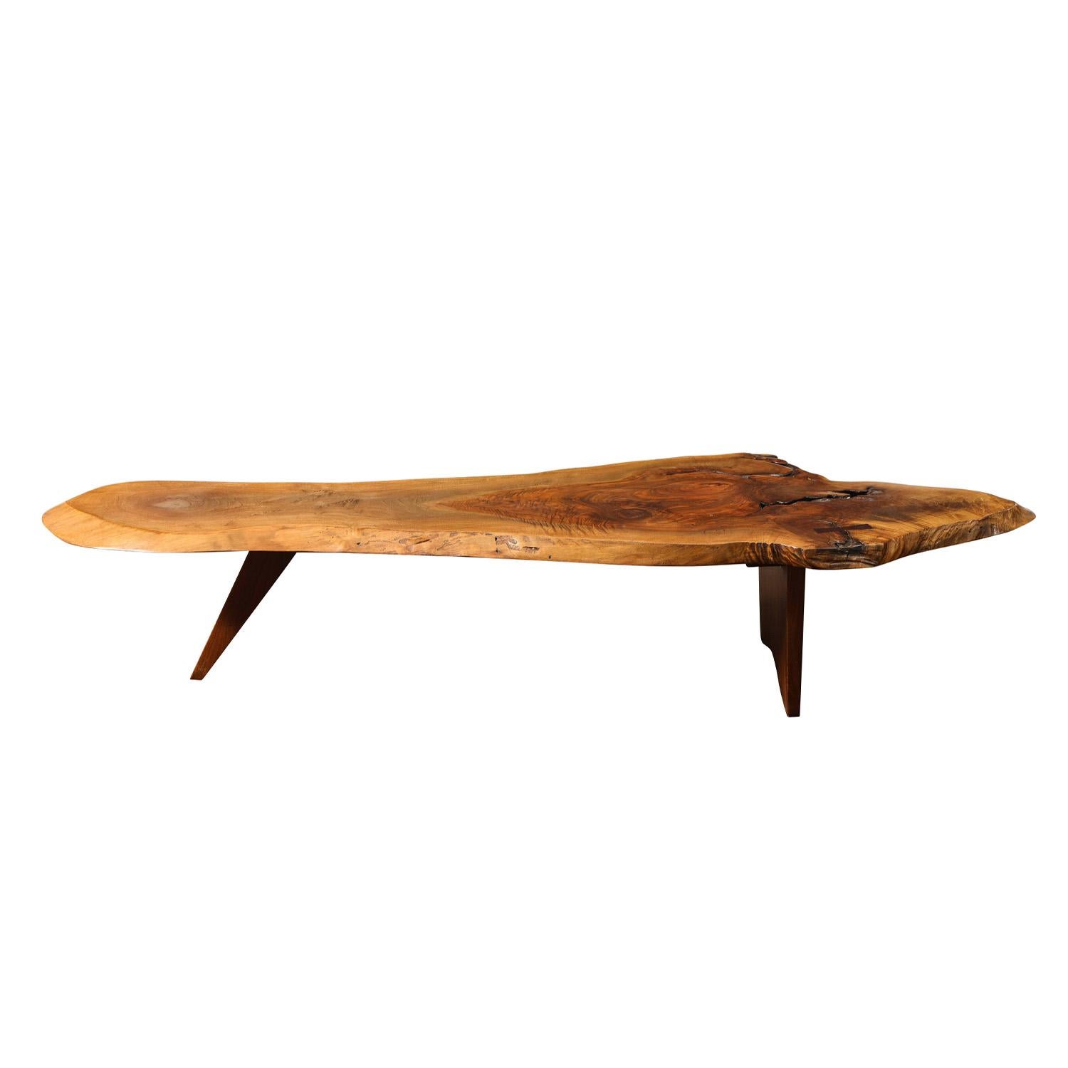 Free Edge Slab Coffee Table in English walnut with rosewood butterfly by George Nakashima, American 1950's. Table features a single slab top with free edges, expressive figured grain, and one rosewood butterfly. A beautiful example of George