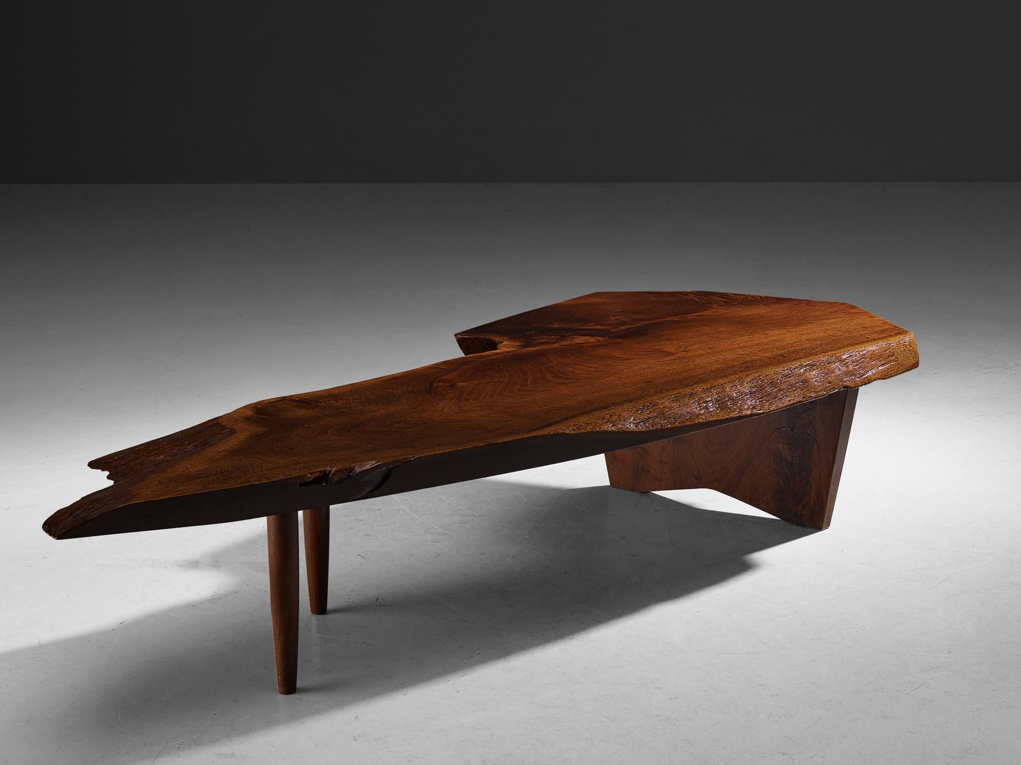 George Nakashima, free edge slab coffee table, walnut, United States, 1968

American woodworker and designer George Nakashima proves with this quintessential table that he is a true master of his craft. The impressive coffee table, created custom