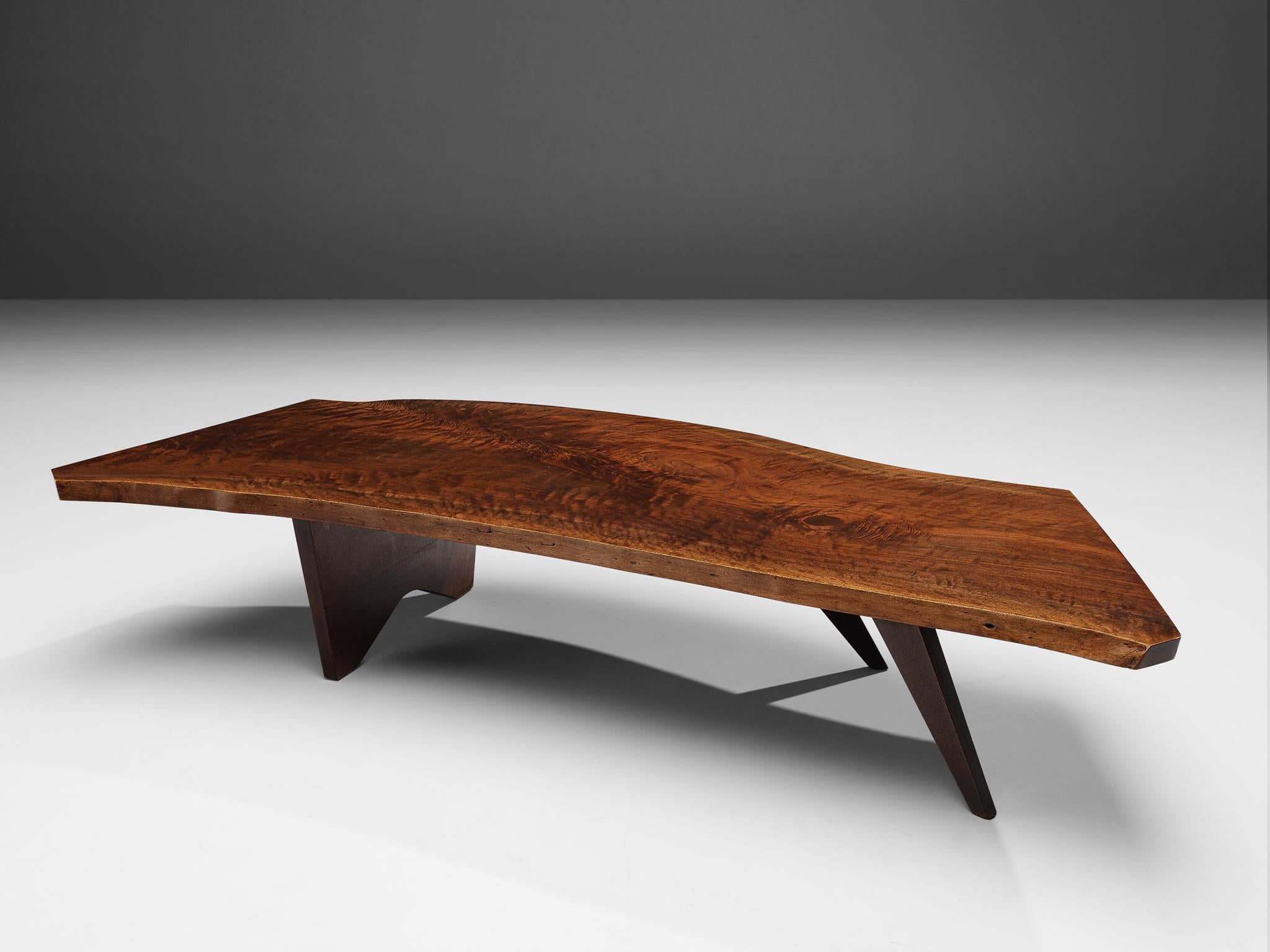 George Nakashima, 'Slab' coffee table, American black walnut, United States, 1960s

American woodworker and designer George Nakashima proves with this quintessential table that he is a true master of his craft. The impressive coffee table, created