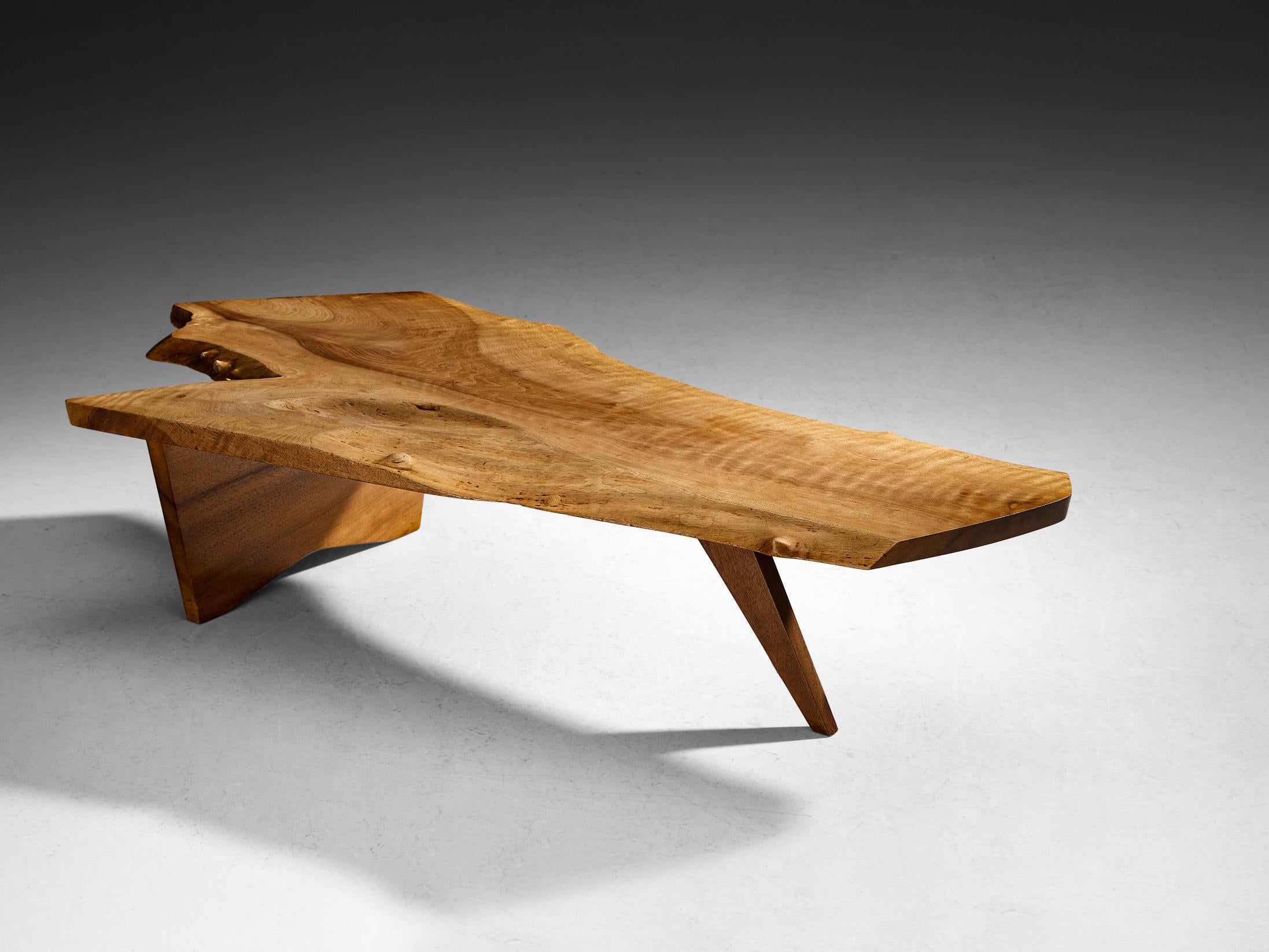 George Nakashima, free edge slab coffee table, English walnut, United States, circa 1960 

American woodworker and designer George Nakashima proves with this quintessential table that he is a true master of his craft. The impressive coffee table,