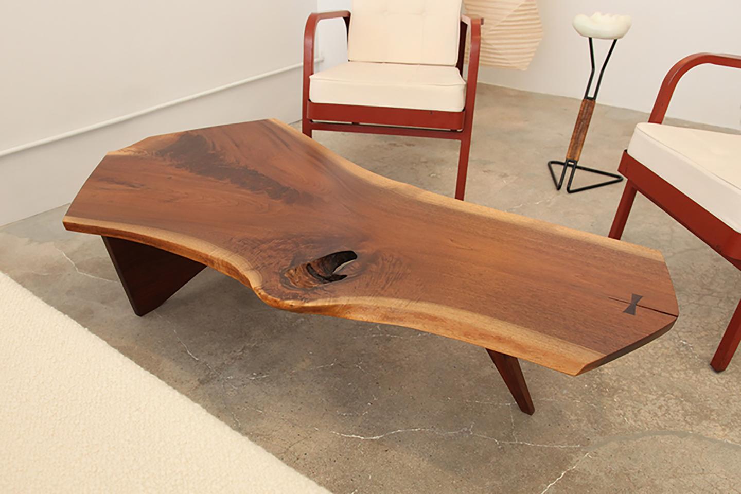A beautiful and soulful, free-from slab coffee table in walnut by George Nakashima, New Hope, PA, circa 1960. Marked underneath with clients name.