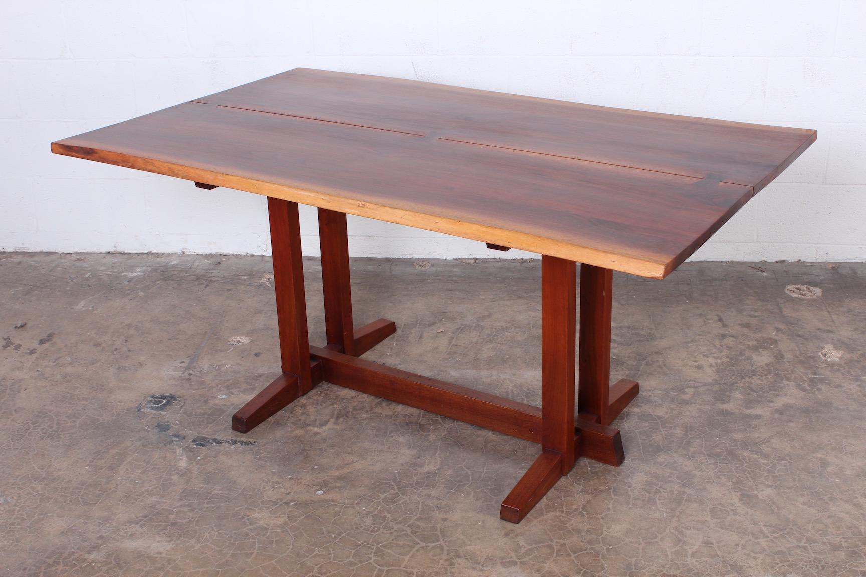 A beautiful sap-grained black walnut top with three rosewood butterfly joints. Sold with paperwork from Nakashima.