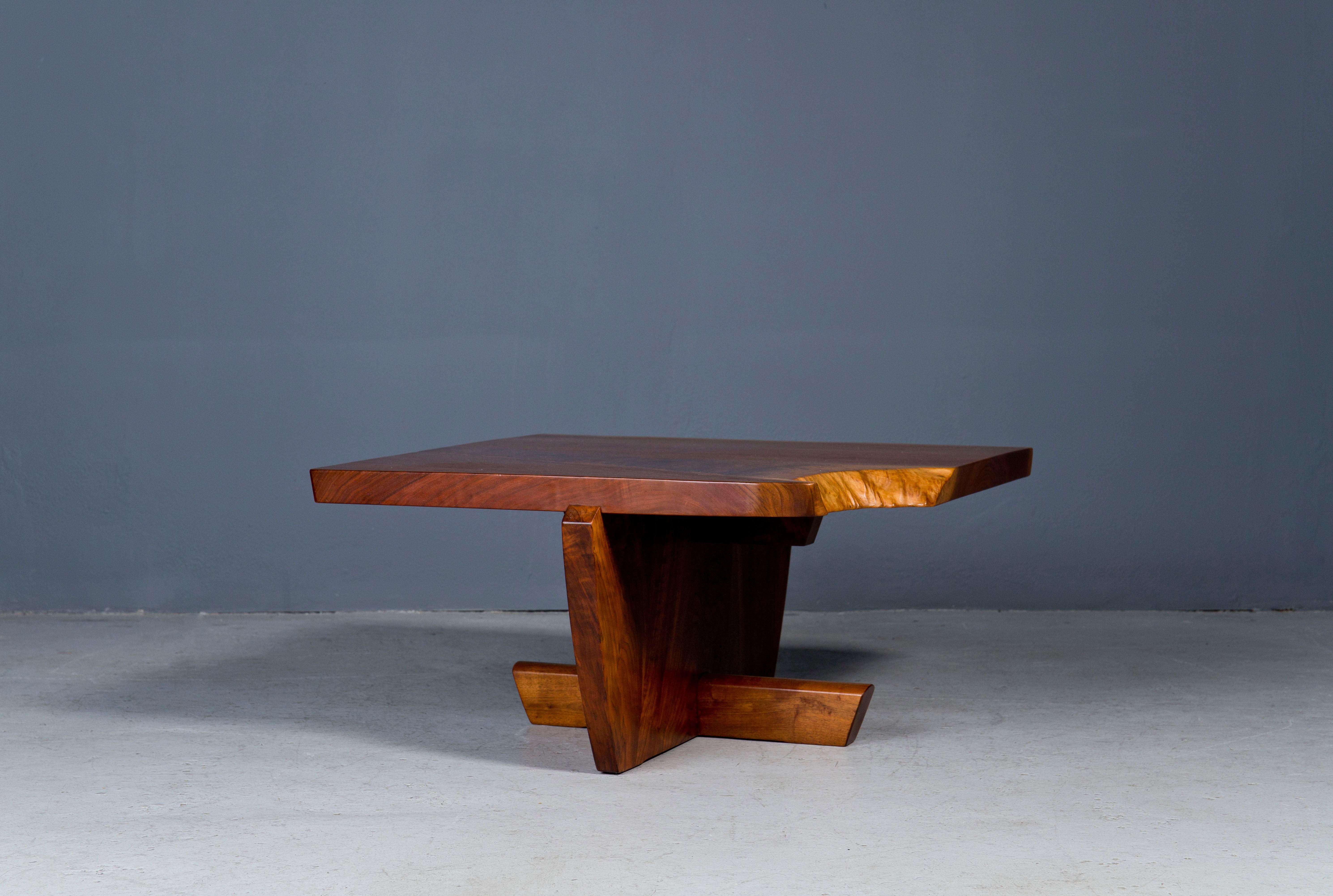 Unique George Nakashima Greenrock coffee table with an expressive grain, single board top, and architectural base.