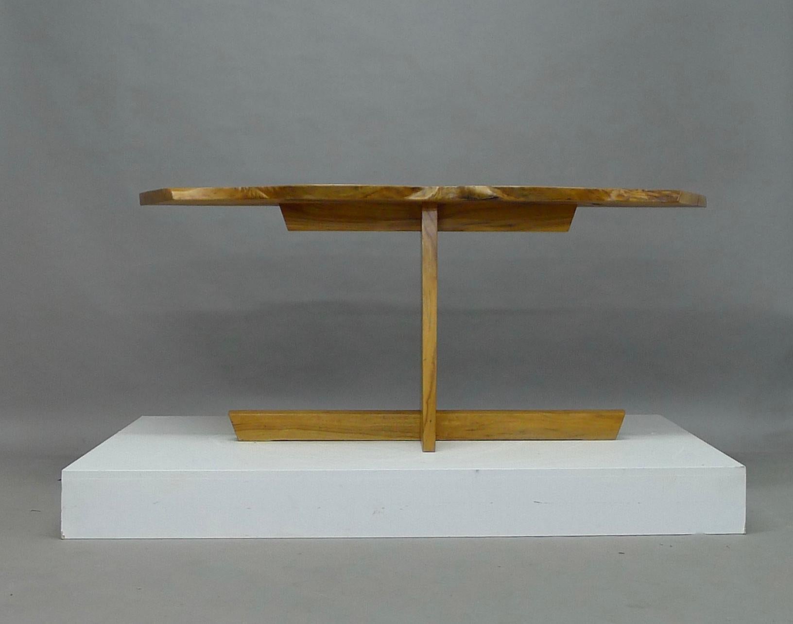 George Nakashima Cabinetmaker, USA, 1987. A stunning Greenrock table with highly figured single slab top in Butternut wood. Features three exposed knots and two walnut butterflies. Signed and dated to the underside (George Nakashima July 10th 1987)