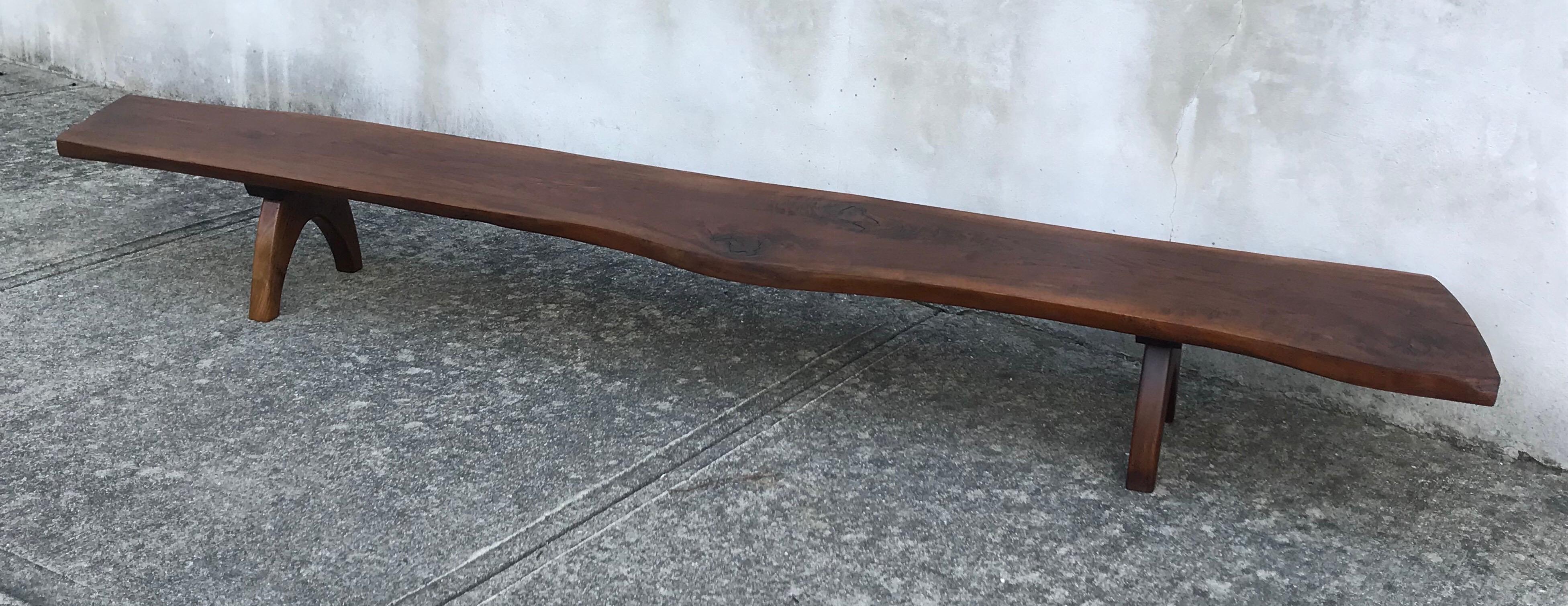 Beautiful nine foot long bench, live edge black walnut. Acquired near New Hope PA, possibly crafted by a disciple or understudy of George Nakashima, early 1950s. Not documented.