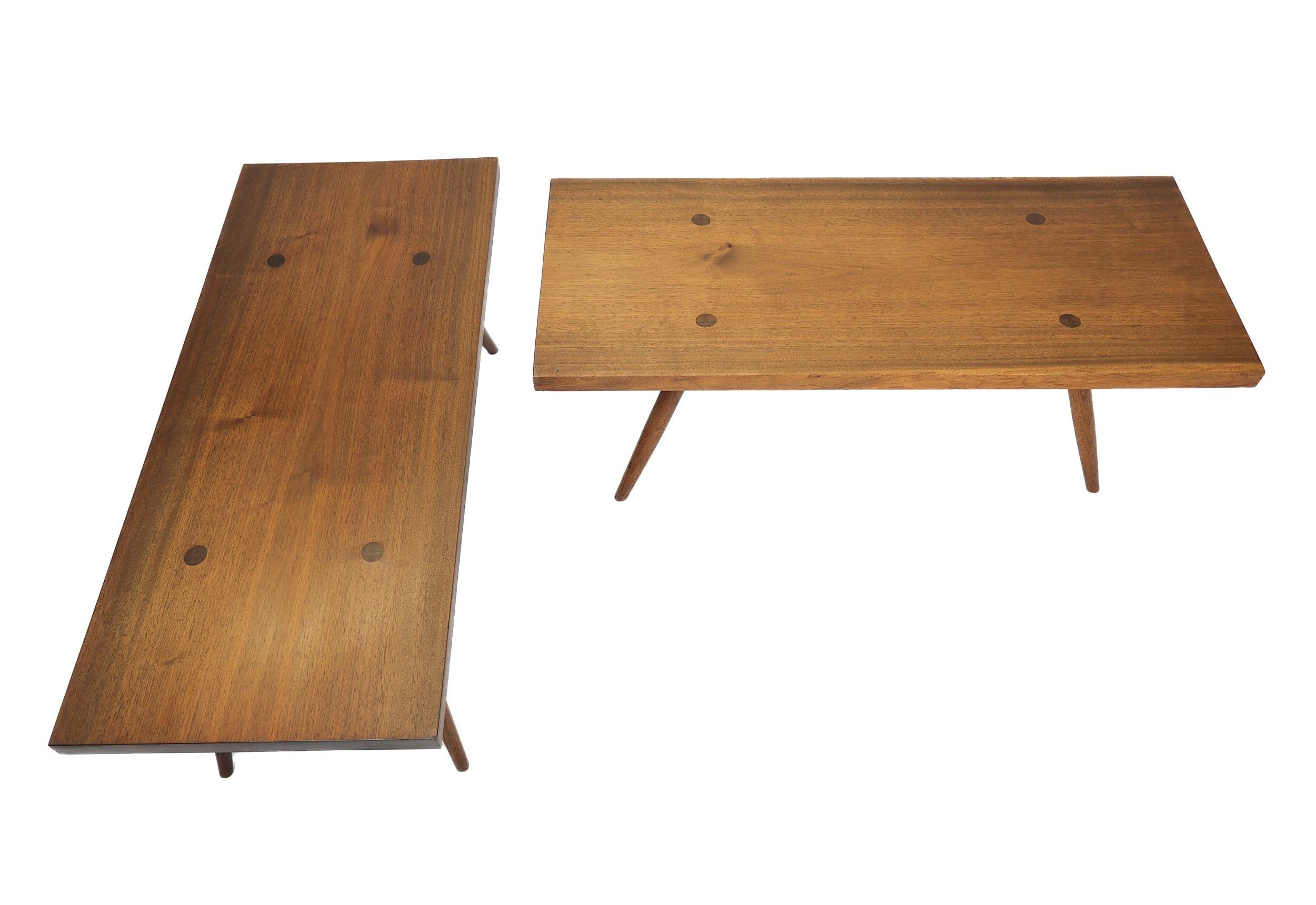 A matched pair of long George Nakashima Tables.
Legs post through the top.
Original finish.