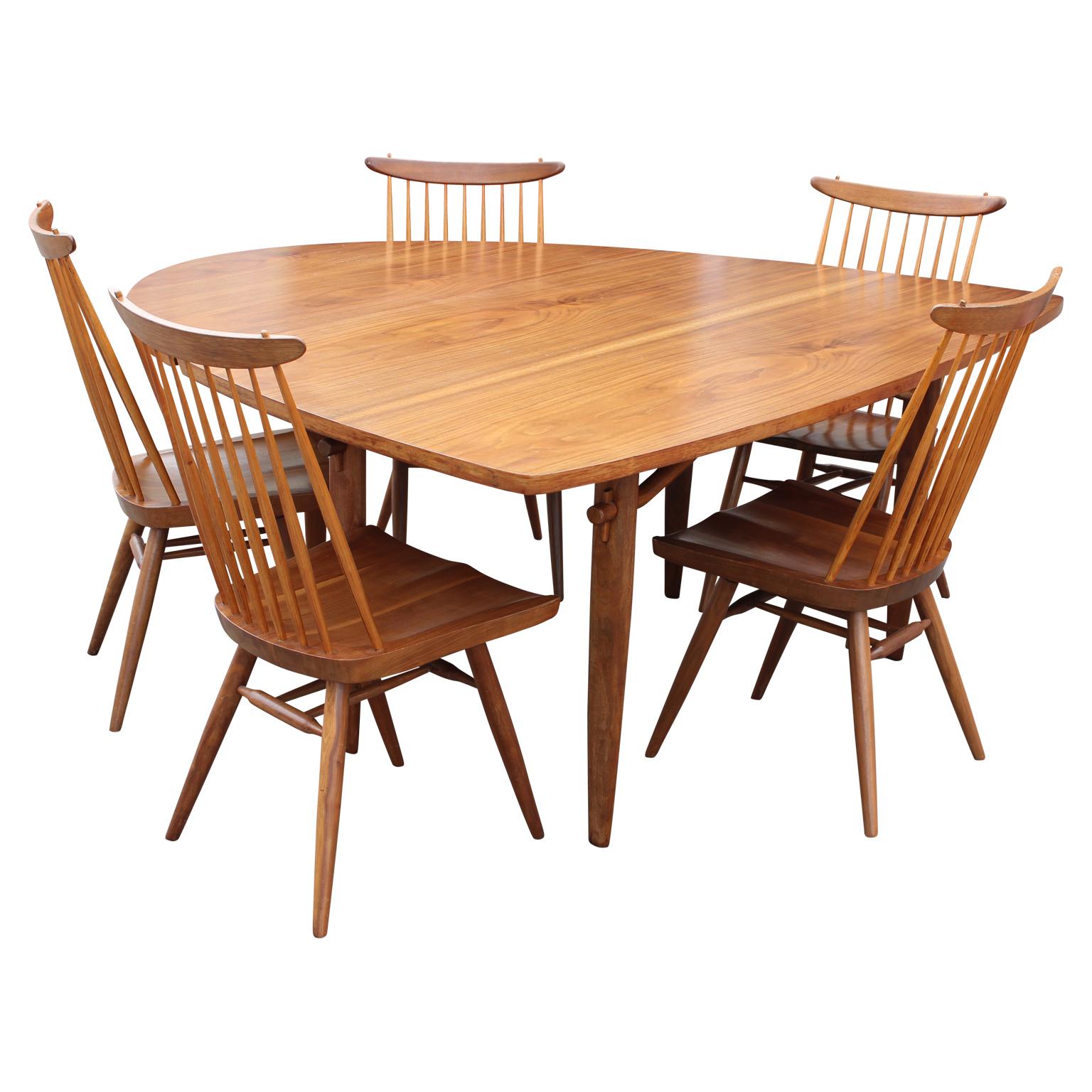 George Nakashima model 793 dining table and set of five chairs. This iconic table and its matching chairs were crafted beautifully for Widdicomb.
 

George Nakashima (USA, 1905-1990)
A master woodworker and M.I.T.-trained architect, George