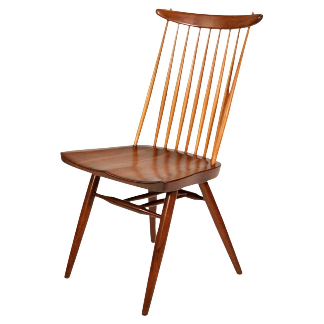Rare and early model 271 or New Chair, the iconic Windsor spindle back chair reimagined by Japanese-American Master Woodworker, George Nakashima in 1956. East Indian Laurel wood in the original Sundra finish with hickory spindles. Branded with