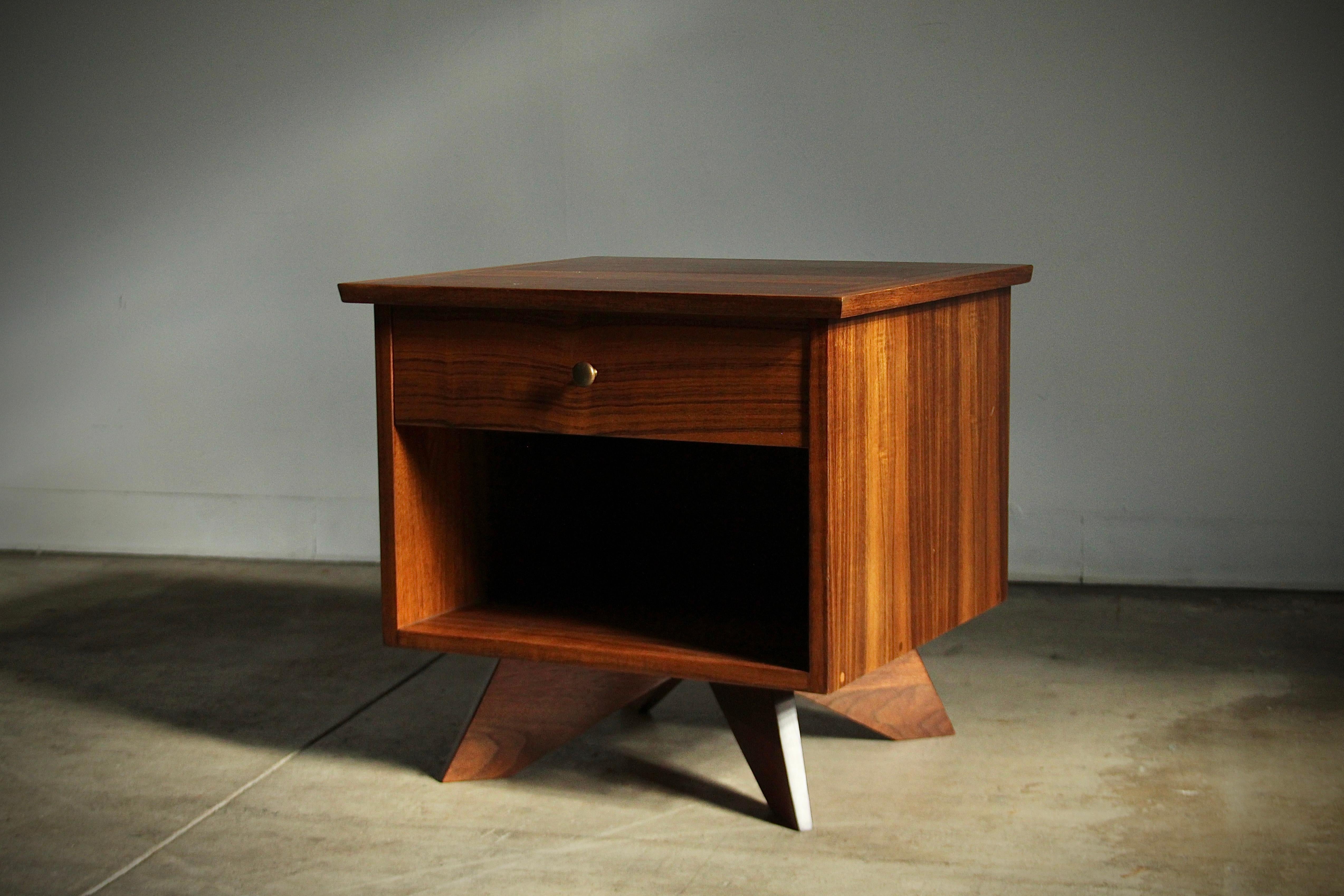 A stunning nightstand designed by George Nakashima and manufactured by Widdicomb in 1959. This example executed in exotic East Indian Laurel wood. Original brass handle. Freshly restored and in fantastic vintage condition, solid and sturdy. Drawer
