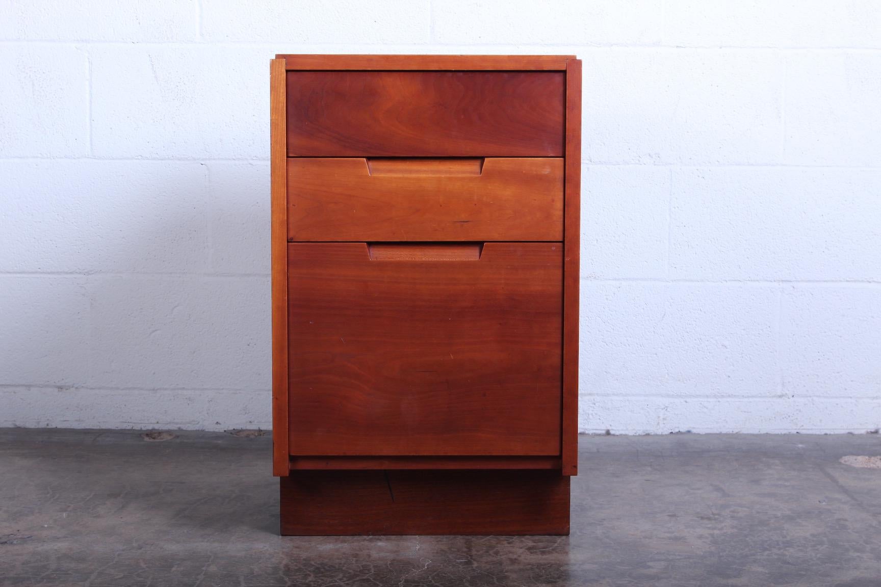 A cherry nightstand designed by George Nakashima in 1963. Sold with copy of original receipt.