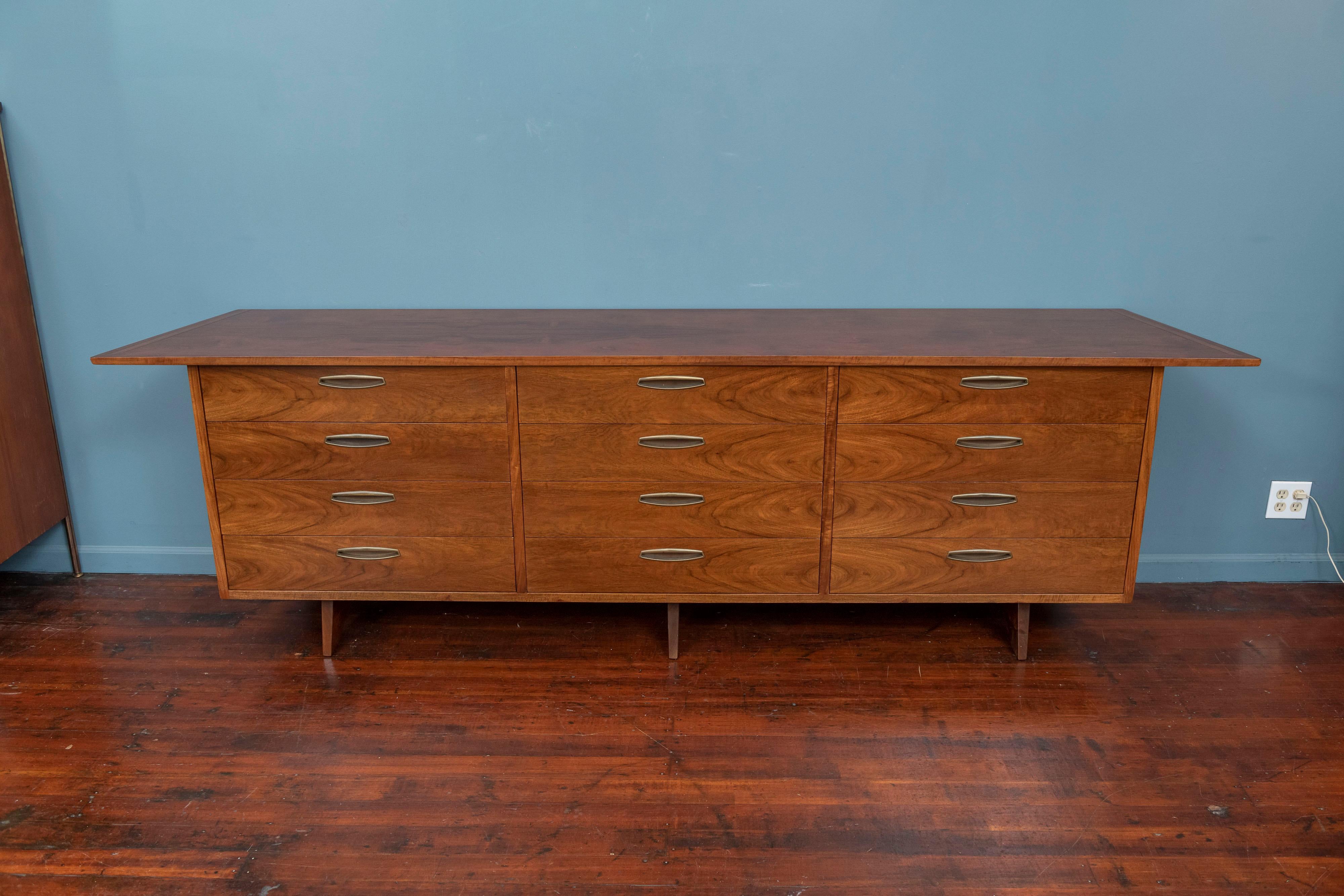 George Nakashima design dresser for his Origins line by Widdicomb, 1959. Dramatic wood grain figuring throughout the body of the case and trapezoidal shape top extending to 105