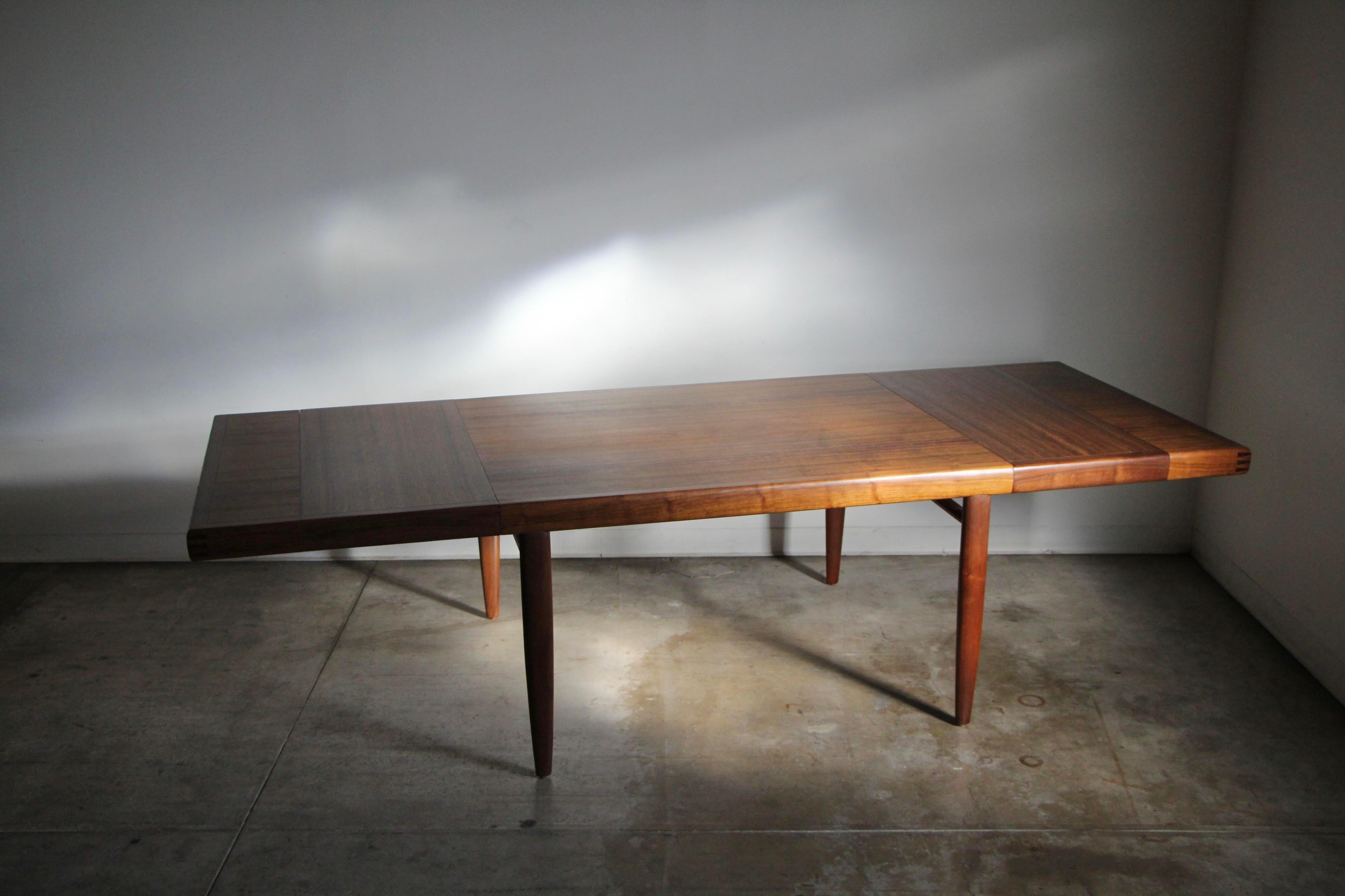 A stunning Mid-Century Modern extension dining table by the master, George Nakashima, part of the 
