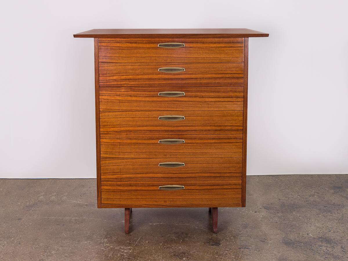 Rare example of the George Nakashima origins oversized tall dresser for Widdicomb. Condition is excellent. Wood is stunning from all angles. This example has the flat brass pulls, and smart wooden pegs that keep the drawers in place. The top’s bowed