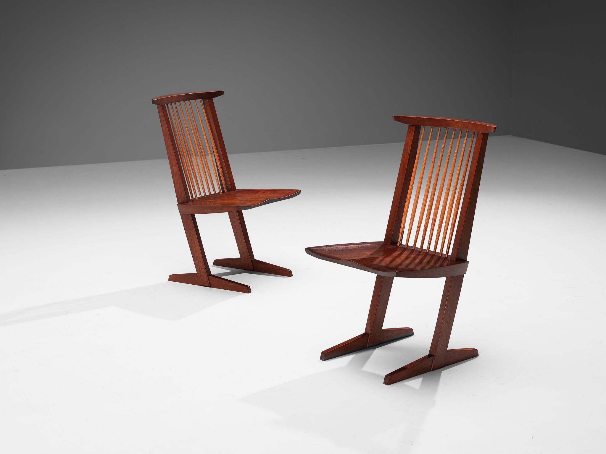 George Nakashima for Nakashima Studio, pair of 'Conoid' chairs, walnut, hickory, United States, 1962

This stunning pair of Conoid dining chairs are designed by woodwork master George Nakashima and made in 1962. The most striking feature of these